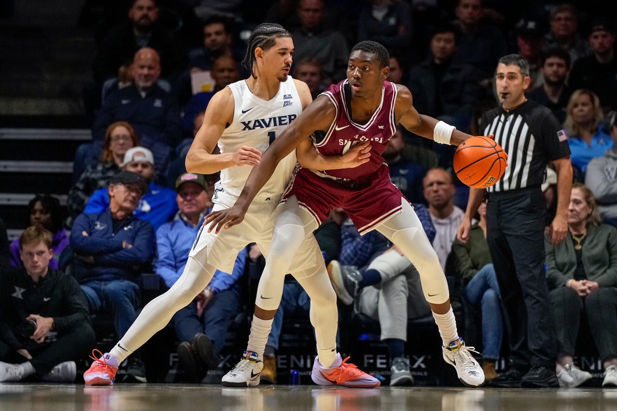 Xavier Musketeers guard Malik Messina-Moore (1) guards Santa Clara Broncos guard Thierry Darlan (15) in the first half of the NCAA Men’s Basketball game between the Xavier Musketeers and the Santa Clara Broncos at the Cintas Center in Cincinnati on Monday, Nov. 10, 2025.