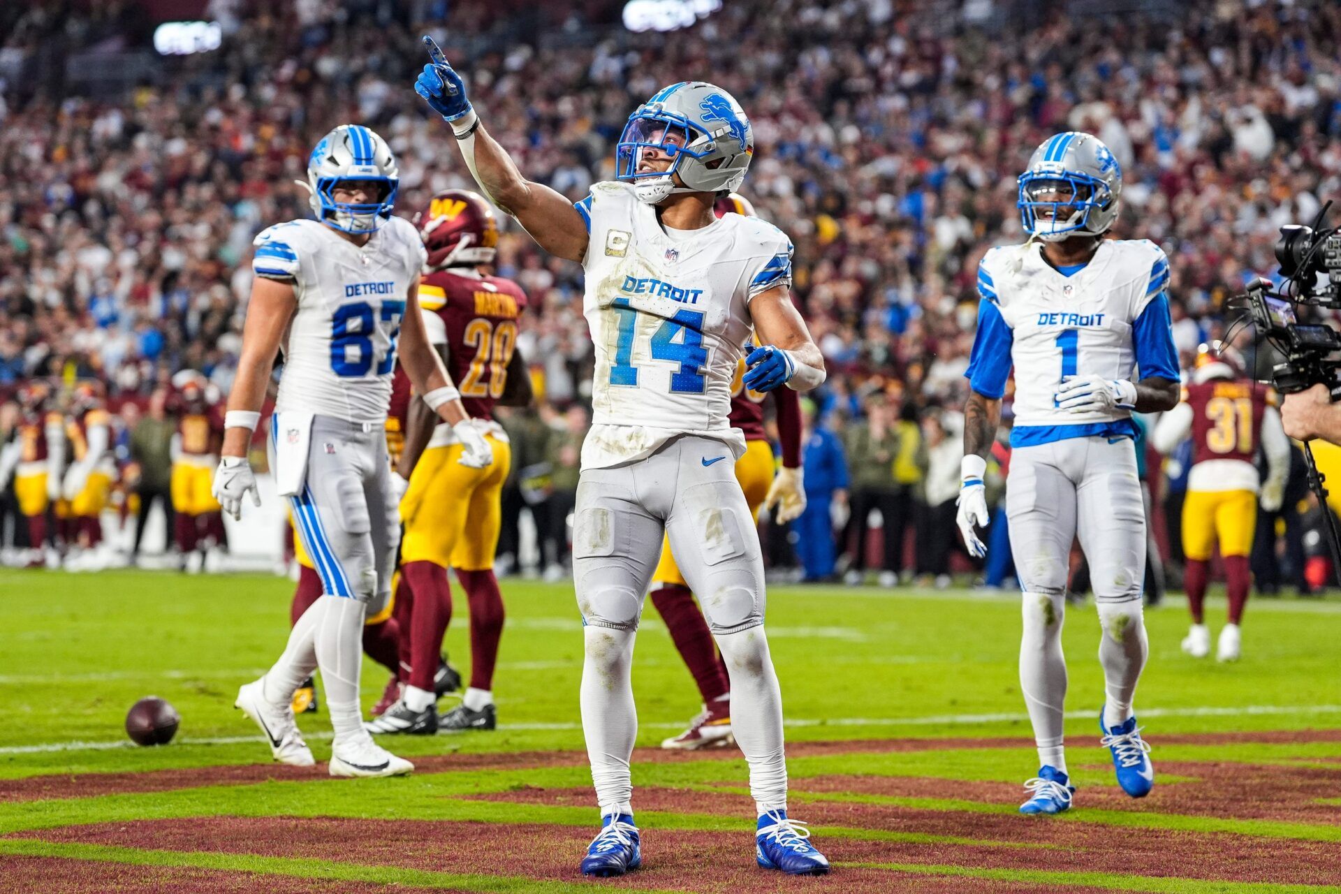 Detroit Lions wide receiver Amon-Ra St. Brown (14) celebrates a touchdown against Washington Commanders during the first half at Northwest Stadium in Landover, Md. on Sunday, November 9, 2025.