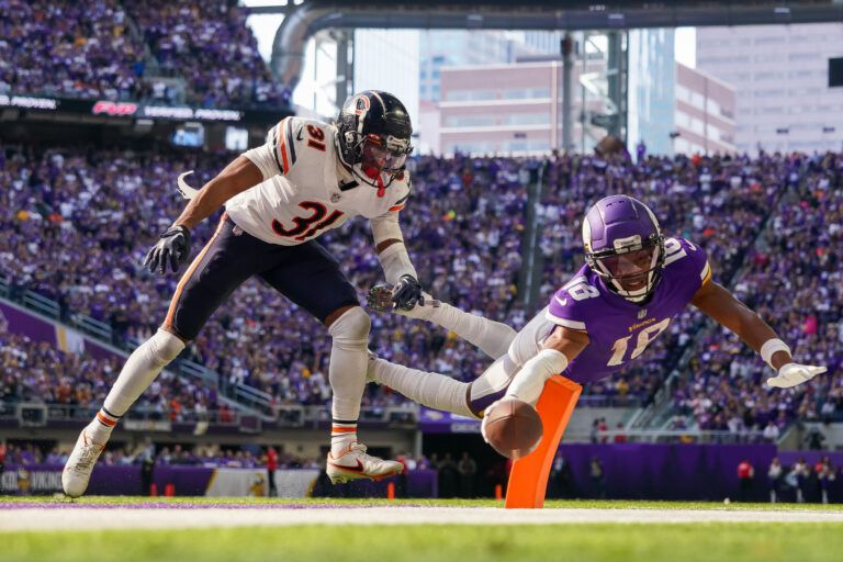 Minnesota Vikings wide receiver Justin Jefferson (18) dives for a two-point conversion against the Chicago Bears cornerback Jaylon Jones (31) in the fourth quarter at U.S. Bank Stadium.