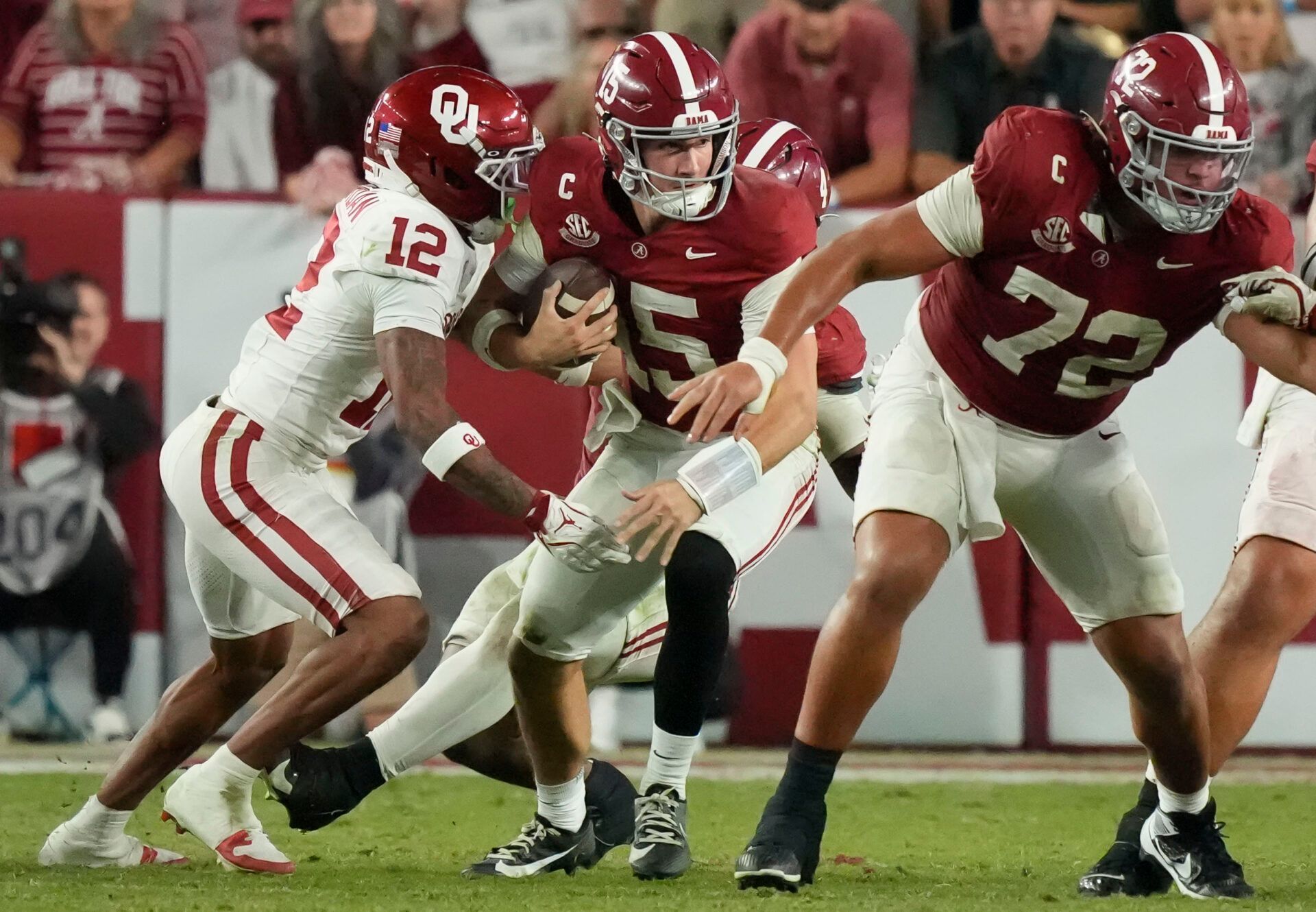 Oklahoma Sooners defensive back Devon Jordan (12) puts pressure on Alabama Crimson Tide quarterback Ty Simpson (15) at Saban Field at Bryant-Denny Stadium. Oklahoma defeated Alabama 23-21.
