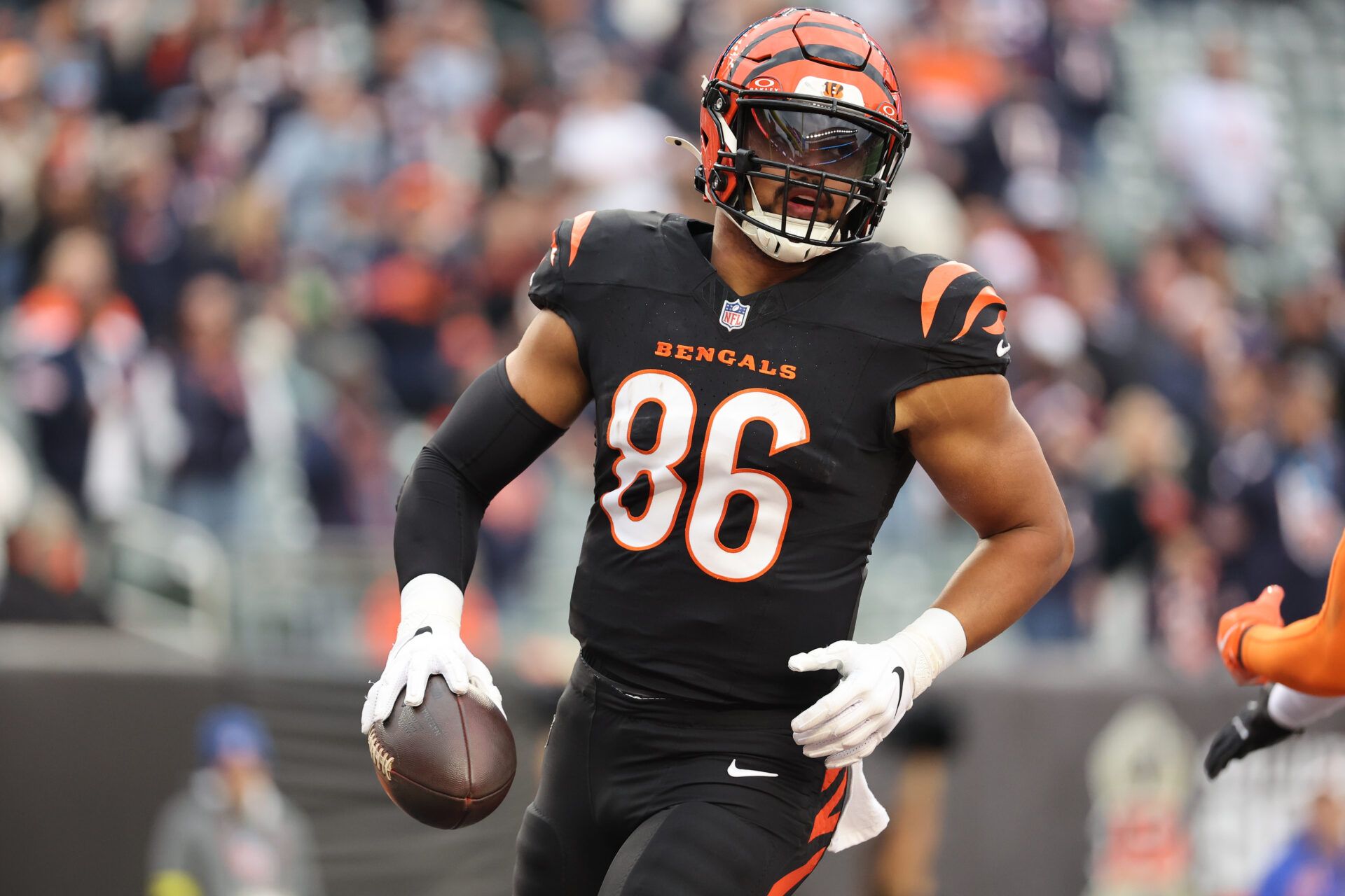 Cincinnati Bengals tight end Noah Fant (86) reacts after catching a 23-yard touchdown pass thrown by Joe Flacco (not pictured) against the Chicago Bears during the fourth quarter at Paycor Stadium.