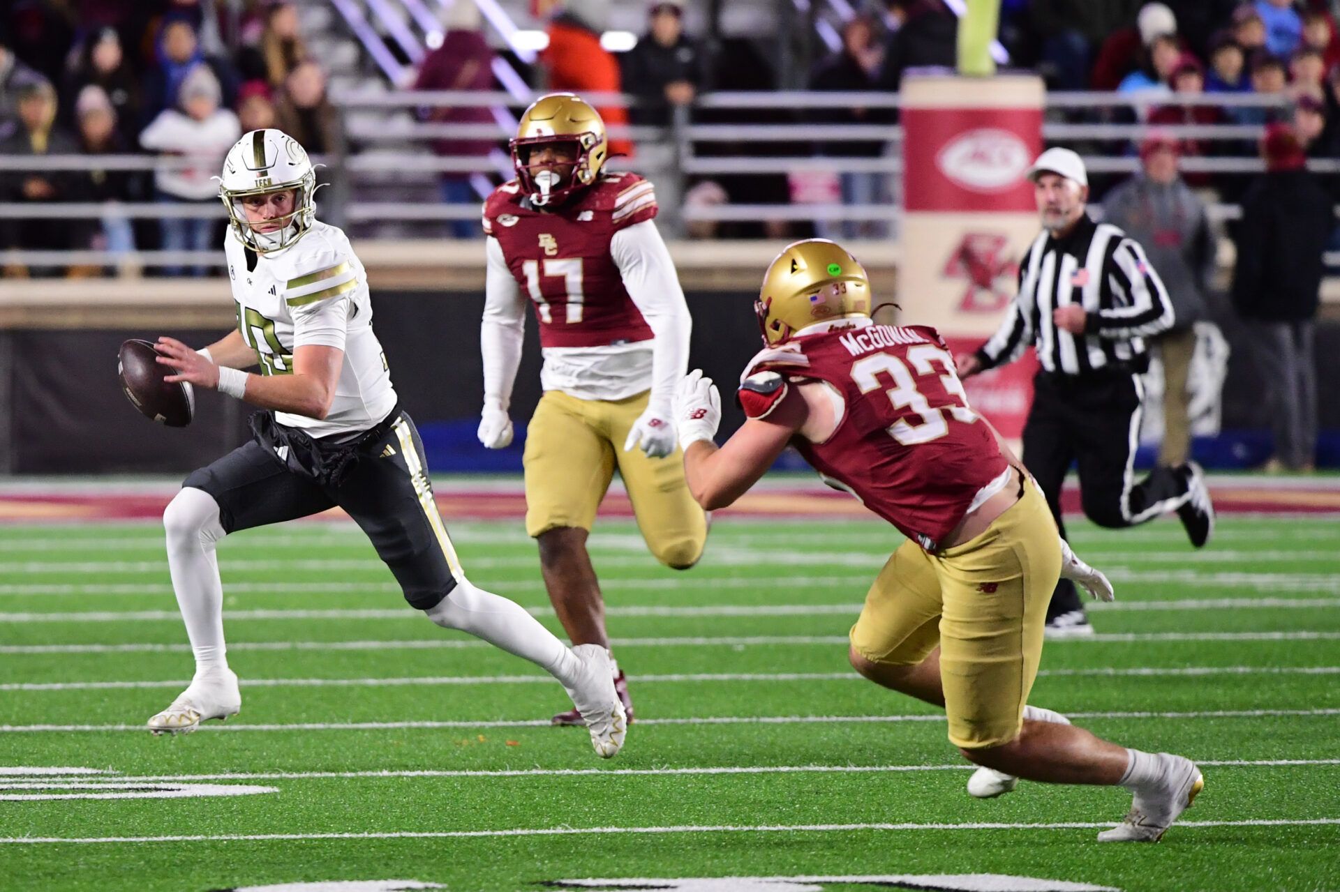 Georgia Tech Yellow Jackets quarterback Haynes King (10) runs with the ball while Boston College Eagles linebacker Owen McGowan (33) defends during the first half at Alumni Stadium.