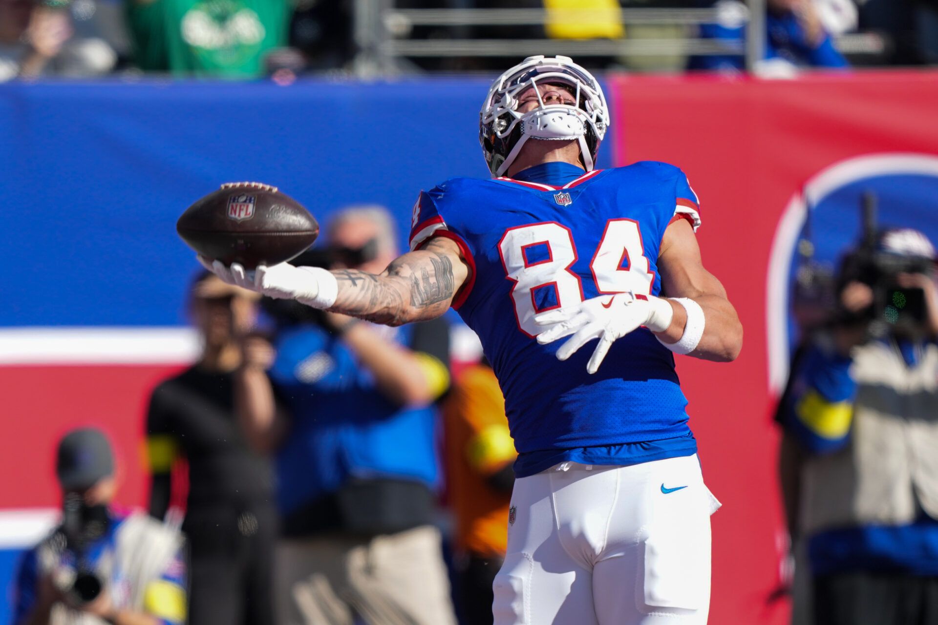 New York Giants tight end Theo Johnson (84) reacts after scoring a touchdown against the San Francisco 49ers during the first half at MetLife Stadium.