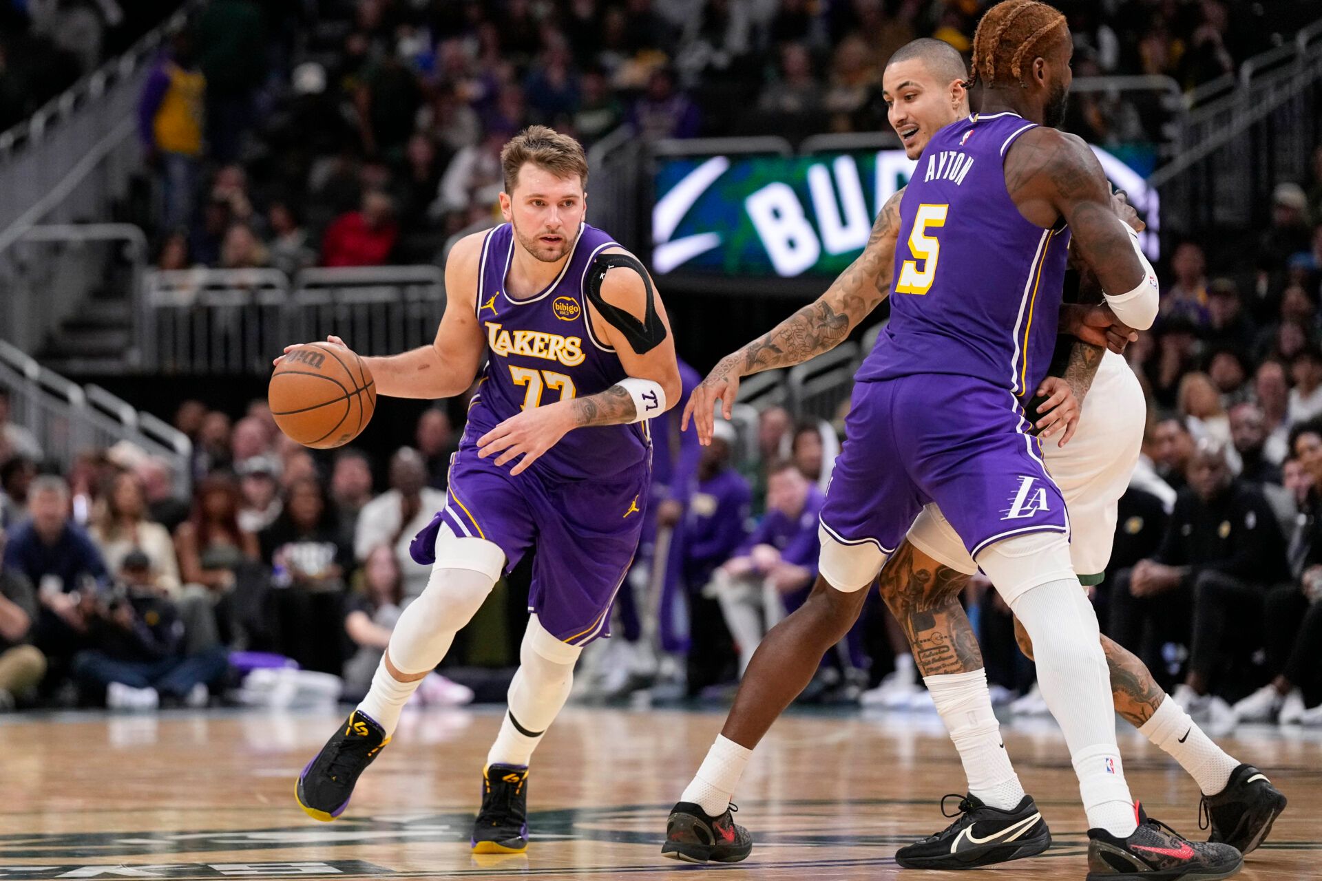 Los Angeles Lakers guard Luka Doncic (77) drives towards the basket during the fourth quarter at Fiserv Forum.