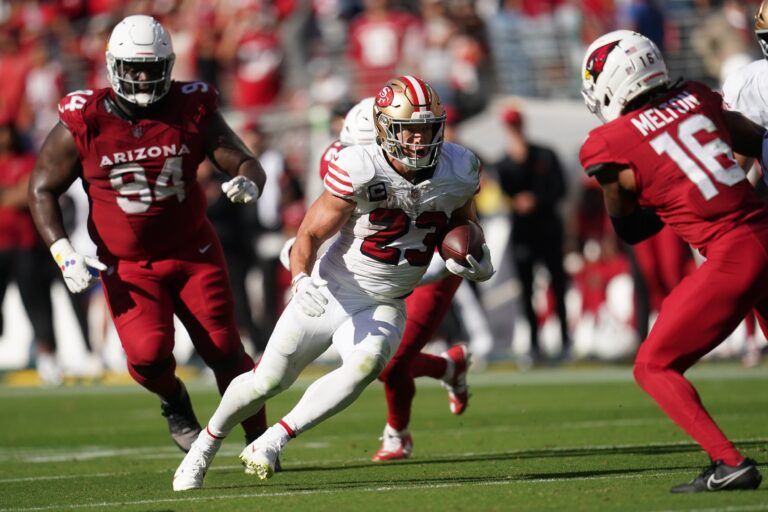 San Francisco 49ers running back Christian McCaffrey (23) carries the ball against the Arizona Cardinals during the second half at Levi's Stadium.
