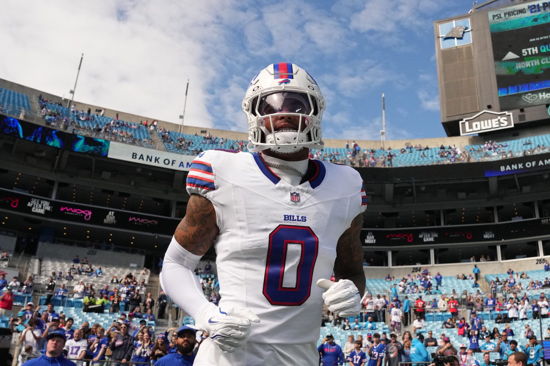 Buffalo Bills wide reciever Keon Coleman (0) runs on to the field before the game at Bank of America Stadium.