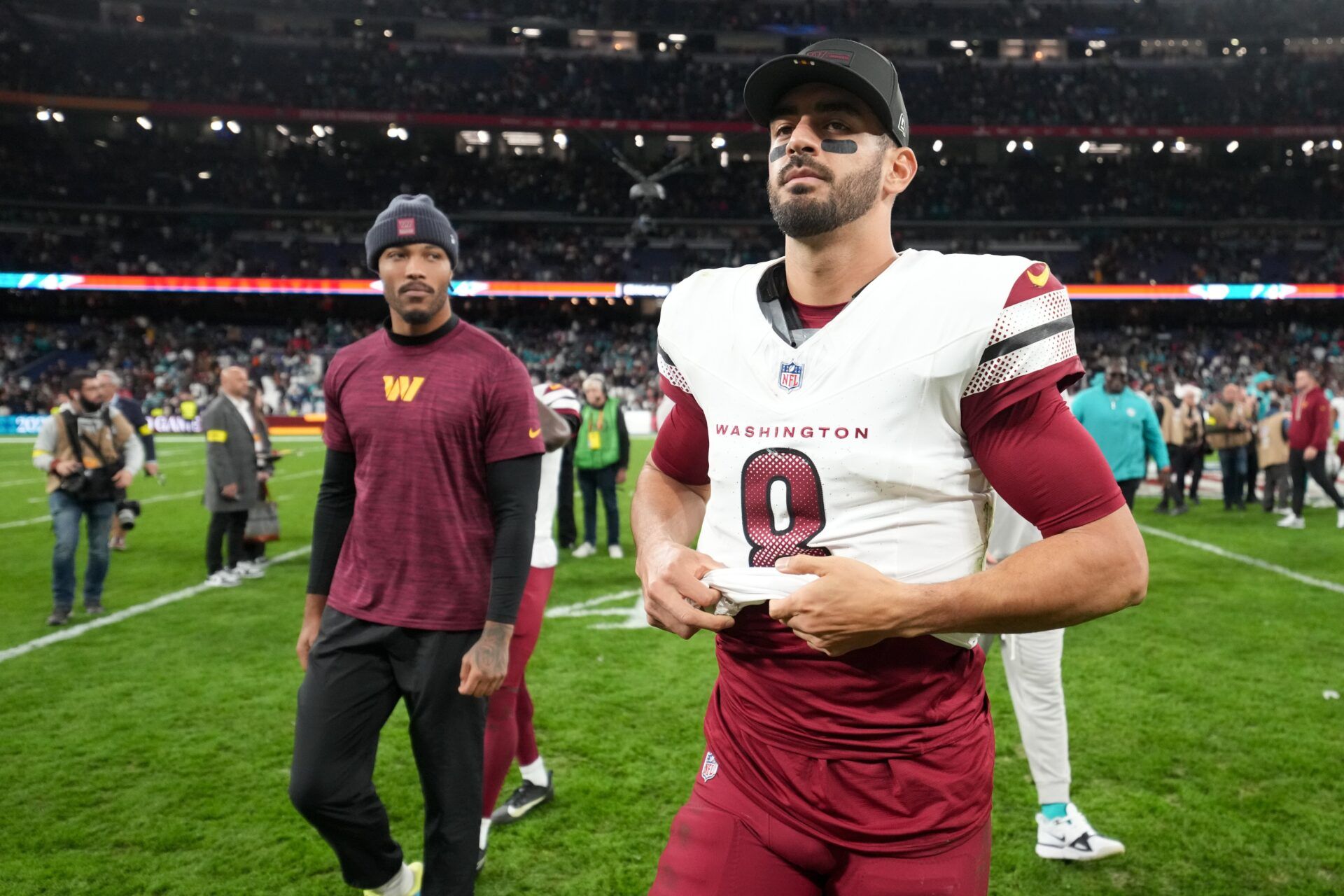 Washington Commanders quarterback Marcus Mariota (8) walks off the field after the 2025 NFL Madrid Game against the Miami Dolphins at Santiago Bernabeu Stadium.