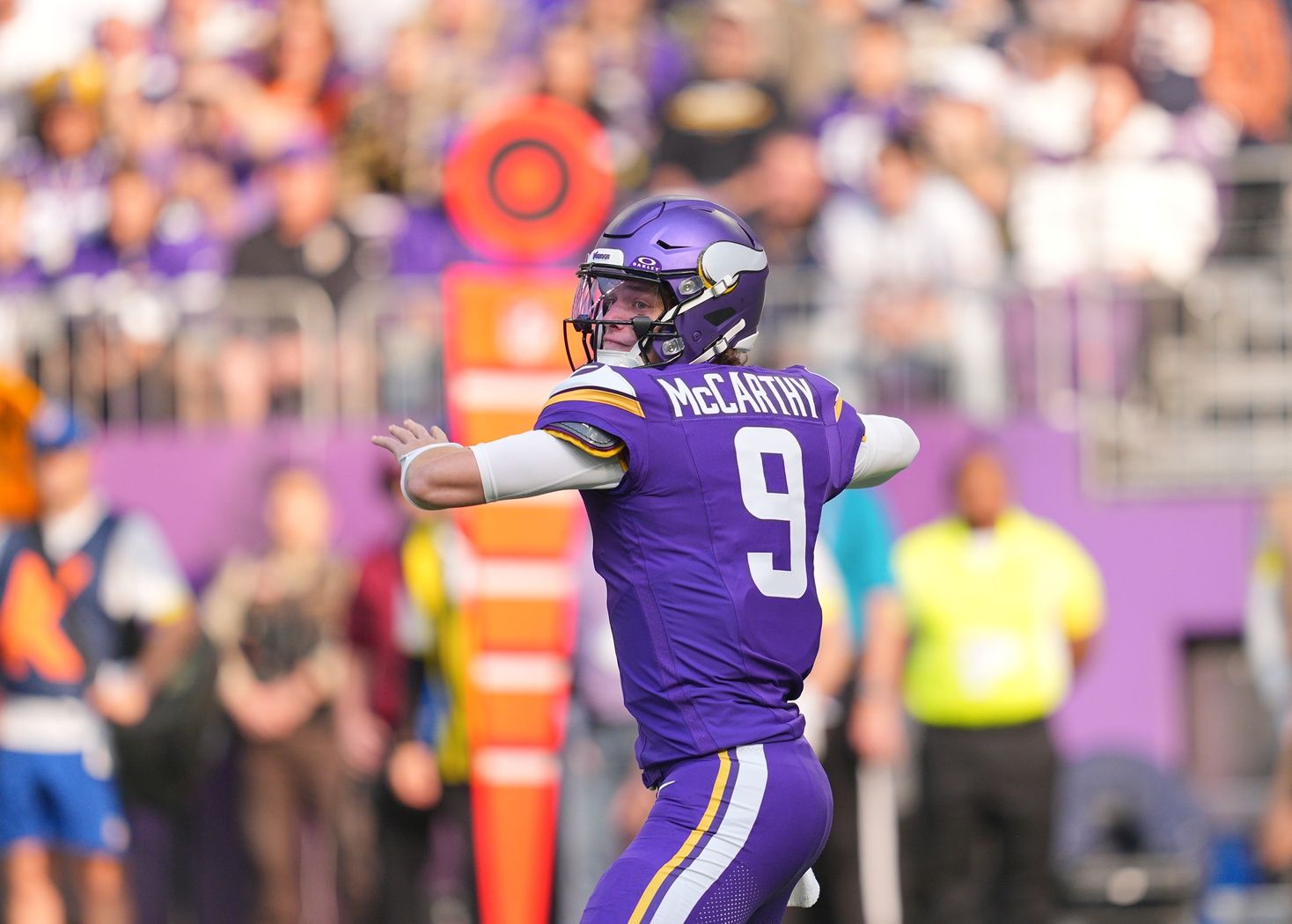 Minnesota Vikings quarterback J.J. McCarthy (9) throws downfield during the first quarter against the Chicago Bears at U.S. Bank Stadium.
