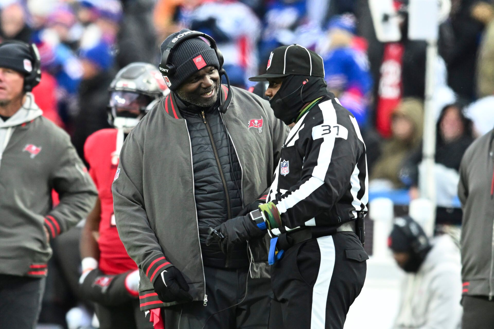 Tampa Bay Buccaneers head coach Todd Bowles talks with line judge Tripp Sutter (37) during the third quarter of the game against the Buffalo Bills at Highmark Stadium.