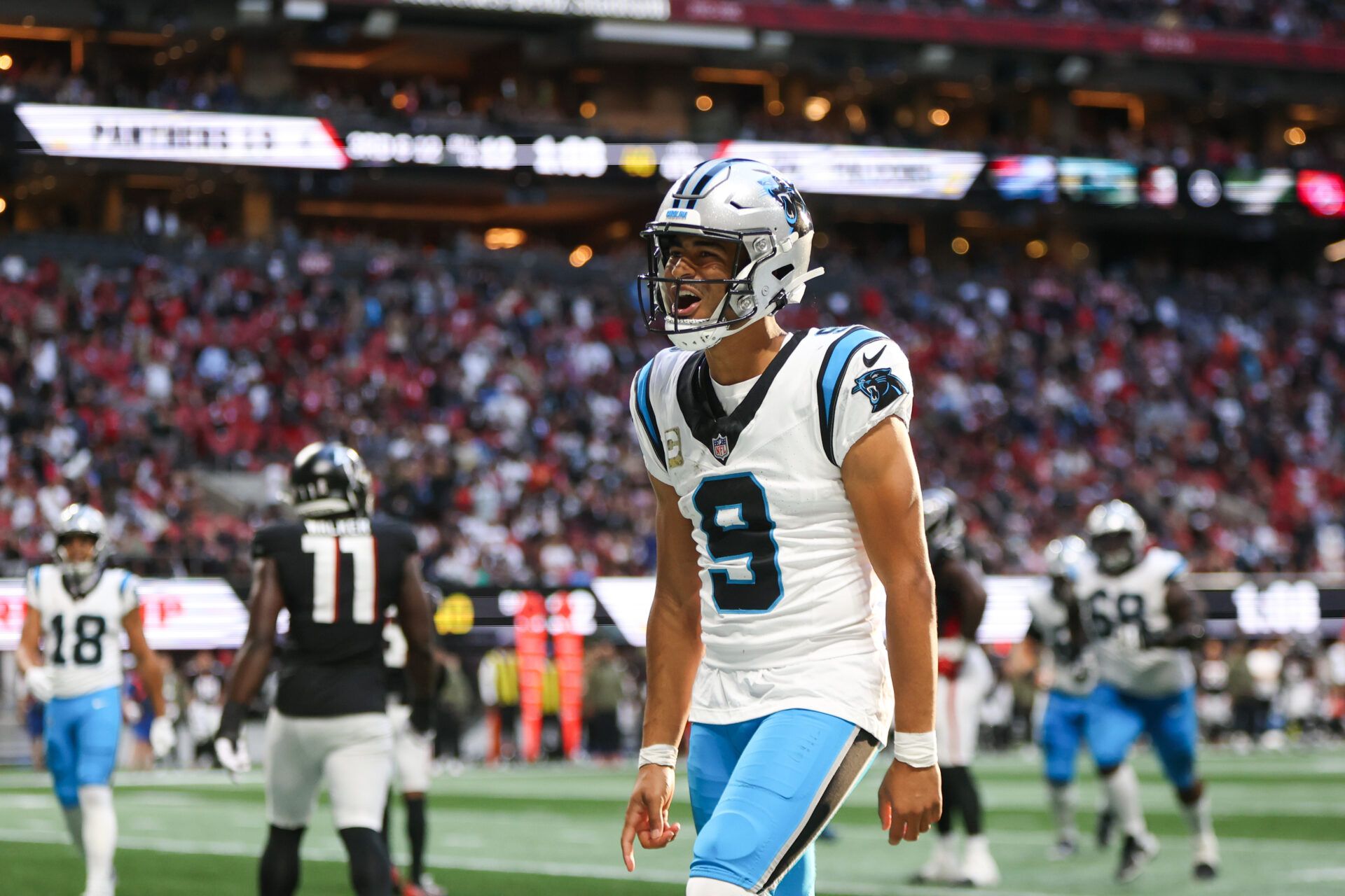 Carolina Panthers quarterback Bryce Young (9) reacts to a touchdown in the fourth quarter against the Atlanta Falcons at Mercedes-Benz Stadium.