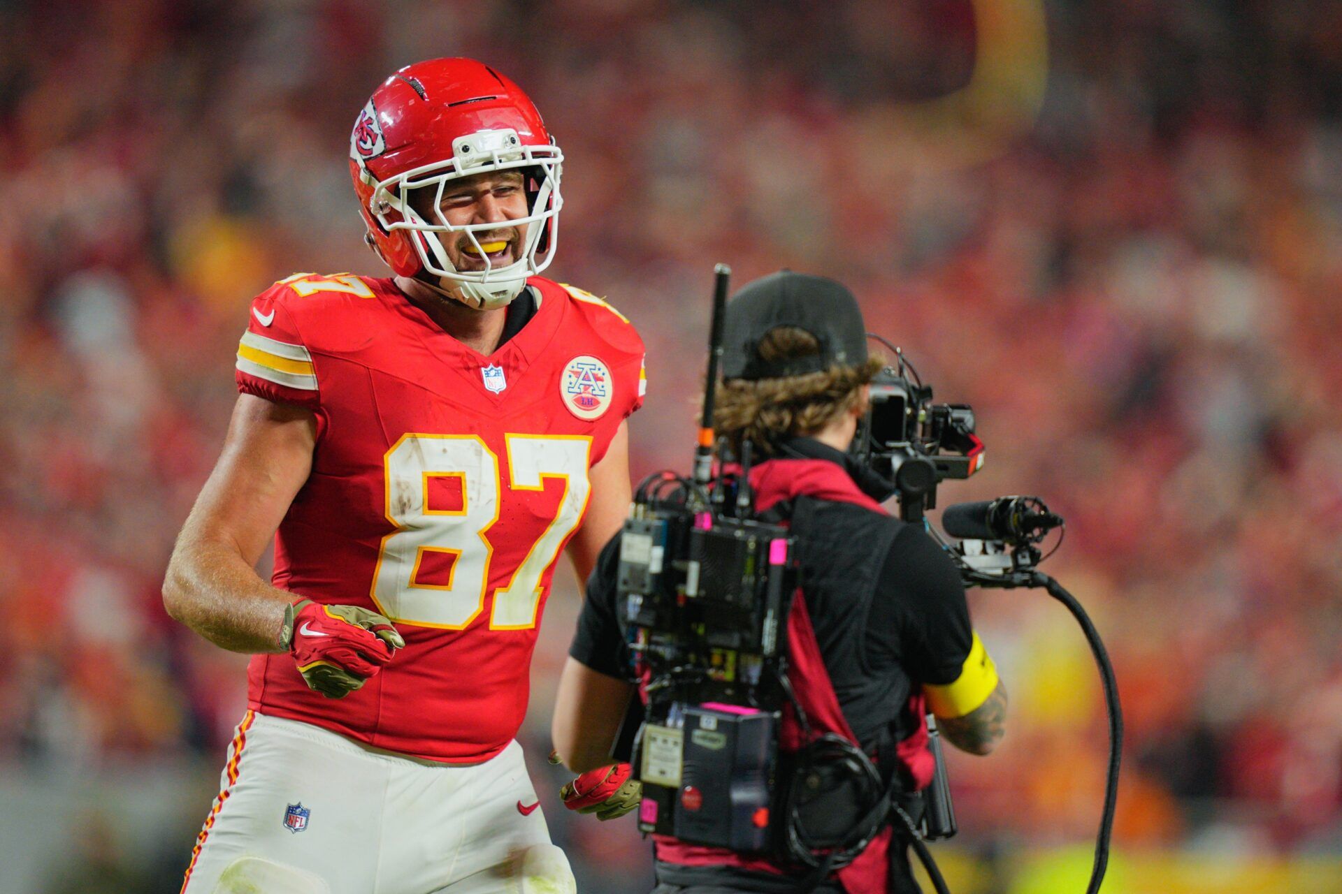 Kansas City Chiefs tight end Travis Kelce (87) celebrates after scoring a touchdown against the Washington Commanders during the third quarter of the game at GEHA Field at Arrowhead Stadium.
