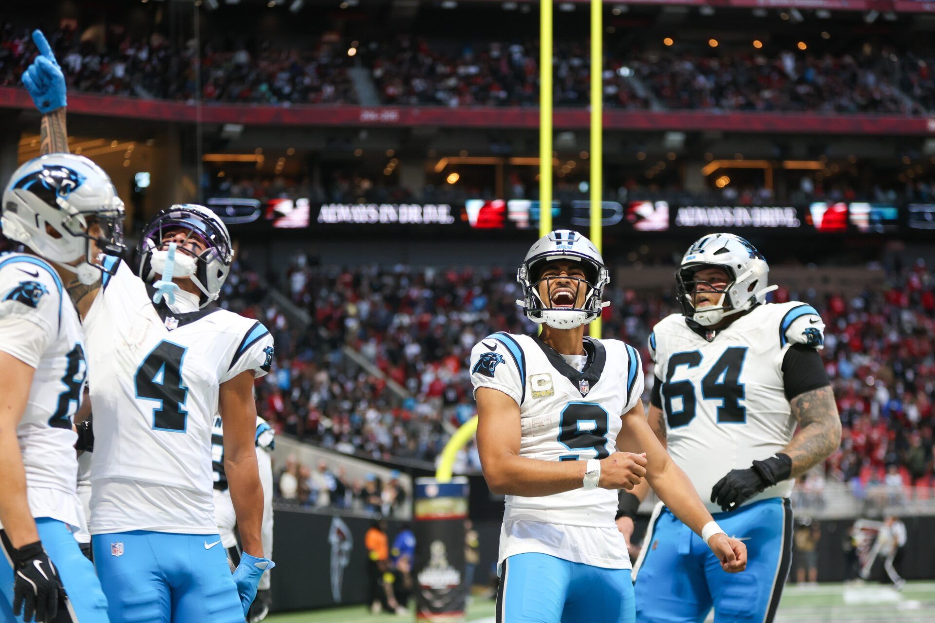 Carolina Panthers quarterback Bryce Young (9) reacts to a touchdown in the fourth quarter against the Atlanta Falcons at Mercedes-Benz Stadium.