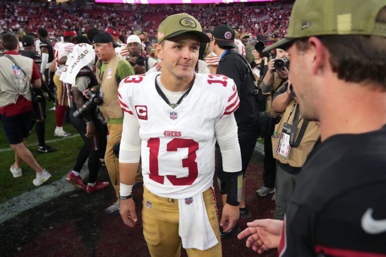 San Francisco 49ers quarterback Brock Purdy (13) interacts with an Arizona Cardinals player after the 49ers' 41-22 win at State Farm Stadium in Glendale on Nov. 16, 2025.