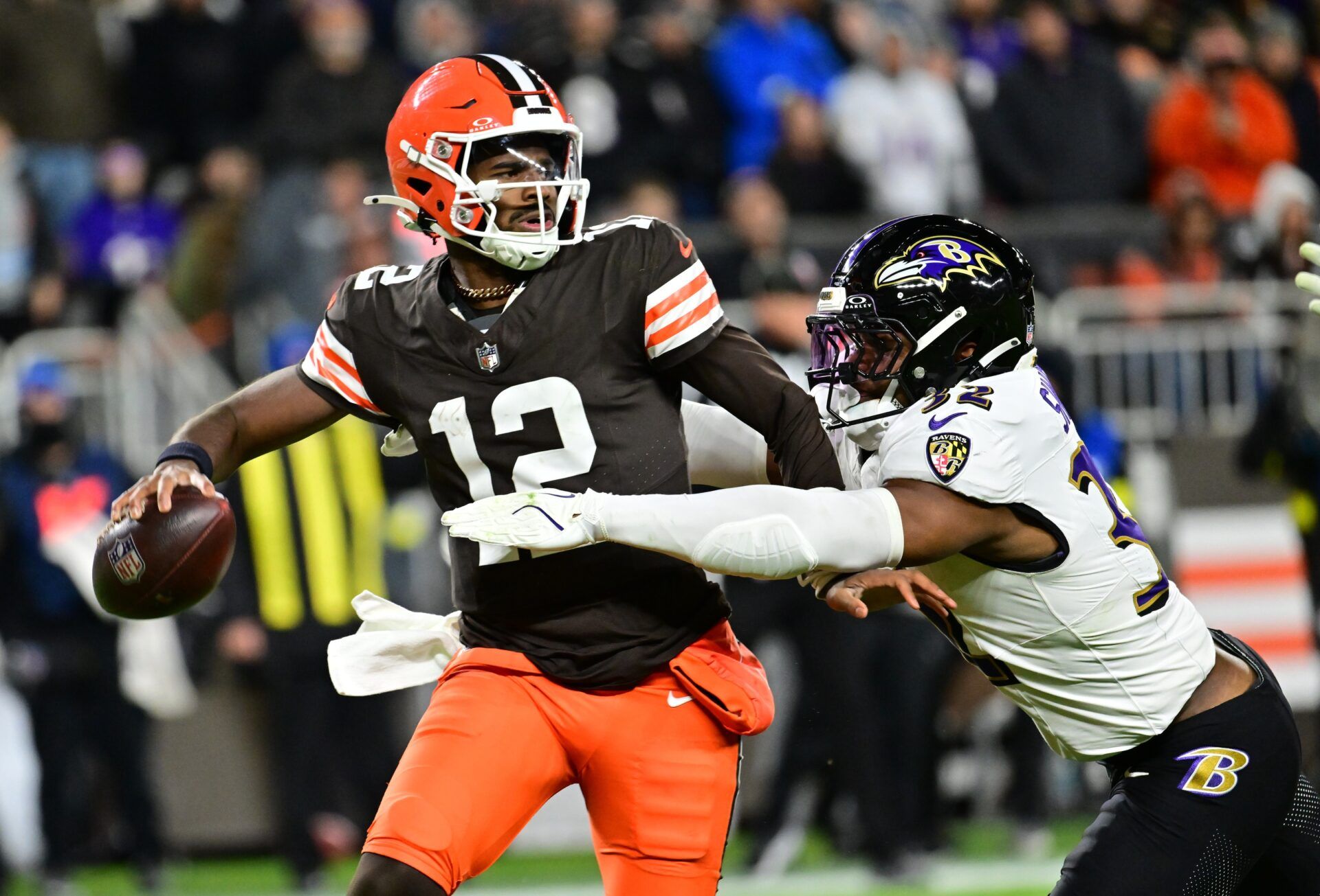 Cleveland Browns quarterback Shedeur Sanders (12) is sacked by Baltimore Ravens linebacker Trenton Simpson (32) during the fourth quarter at Huntington Bank Field.