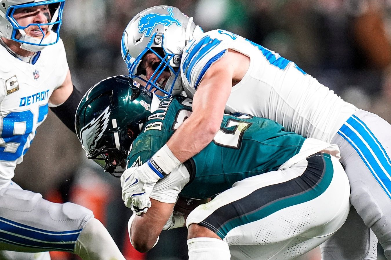 Detroit Lions linebacker Jack Campbell (46) tackles Philadelphia Eagles running back Saquon Barkley (26) during the first half at Lincoln Financial Field in Philadelphia on Sunday, November 16, 2025.