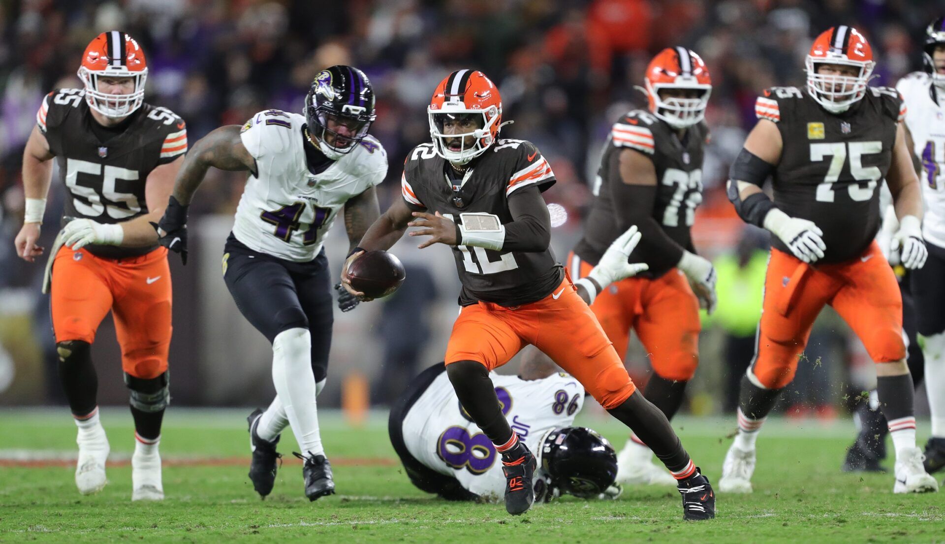 Cleveland Browns quarterback Shedeur Sanders (12) scrambles for yards during the second half of an NFL football game against the Baltimore Ravens at Huntington Bank Field, Nov. 16, 2025, in Cleveland, Ohio.