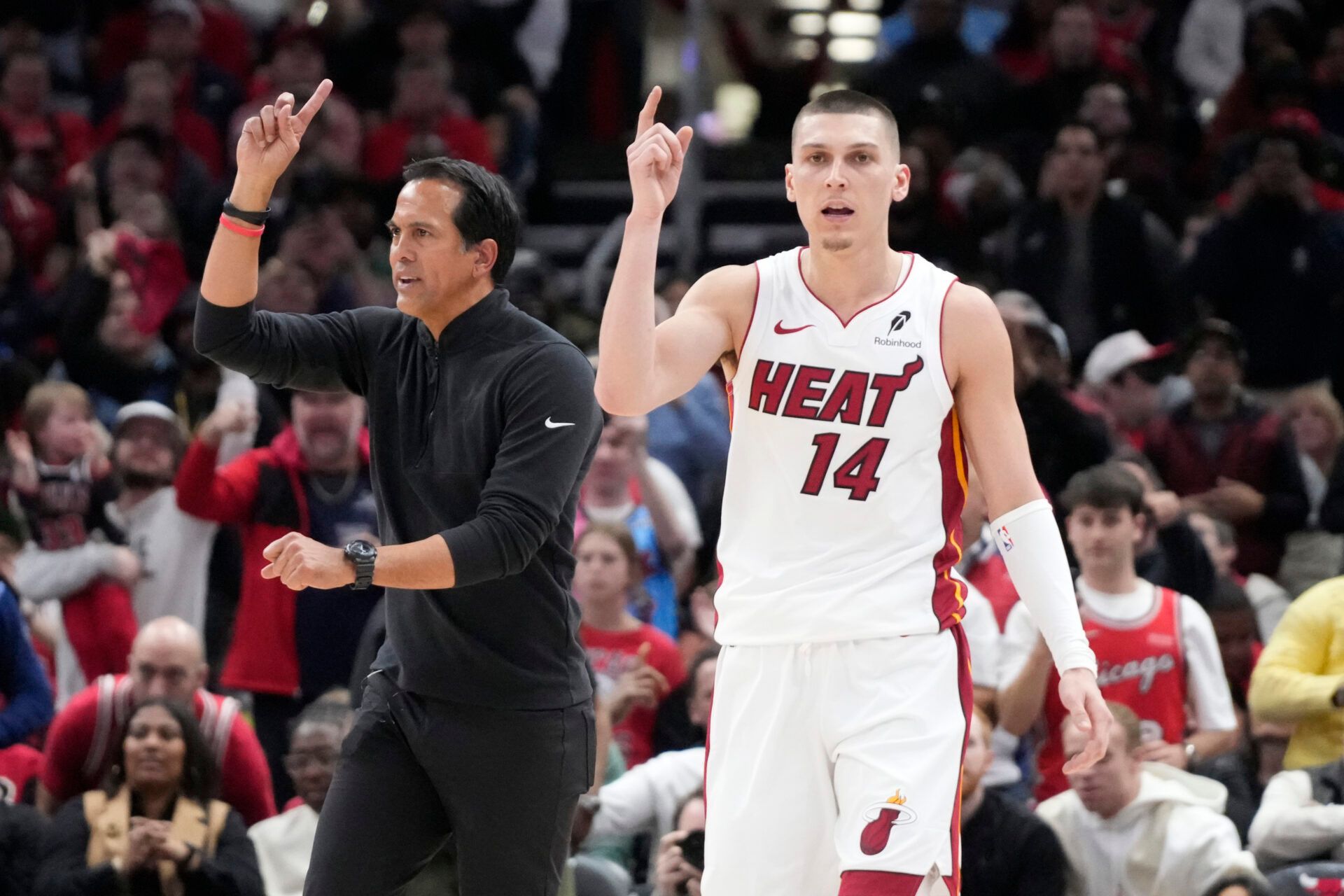 Miami Heat guard Tyler Herro (14) and head coach Erik Spoelstra ask for a replay against the Chicago Bulls during the second half at United Center.