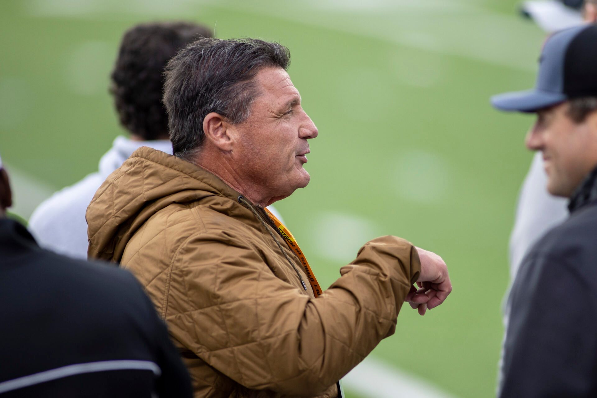 Former LSU Tigers head coach Ed Orgeron (center) makes an appearance during American practice for the 2022 Senior Bowl at Hancock Whitney Stadium.