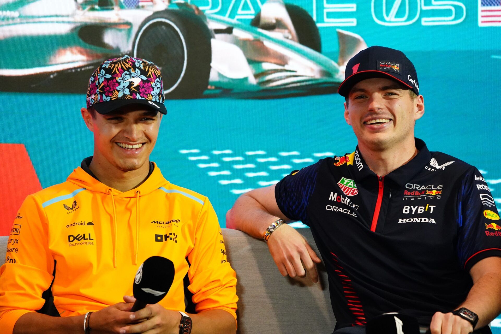 McLaren driver Lando Norris (4) of Great Britain shares a laugh with  Red Bull driver Max Verstappen (1) of the Netherlands before media session at Miami International Autodrome.