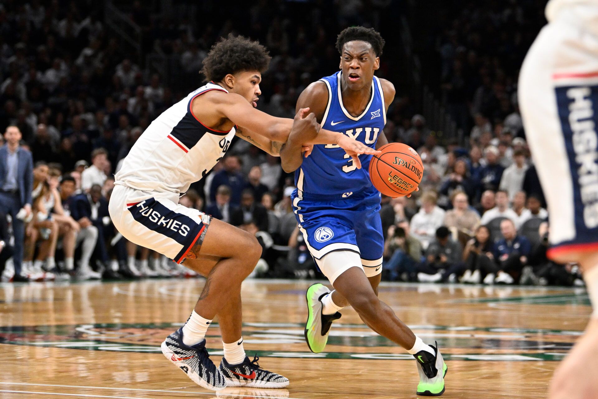 UConn Huskies forward Jaylin Stewart (3) fouls BYU Cougars forward AJ Dybantsa (3)  during the second half at TD Garden.