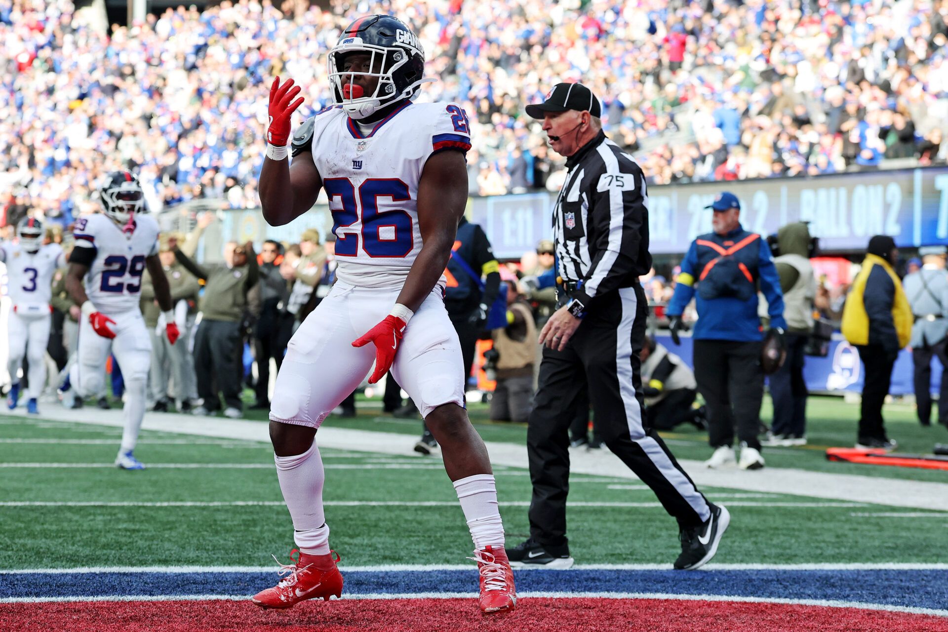 New York Giants running back Devin Singletary (26) celebrates scoring a touchdown during the second quarter against the Green Bay Packers at MetLife Stadium.