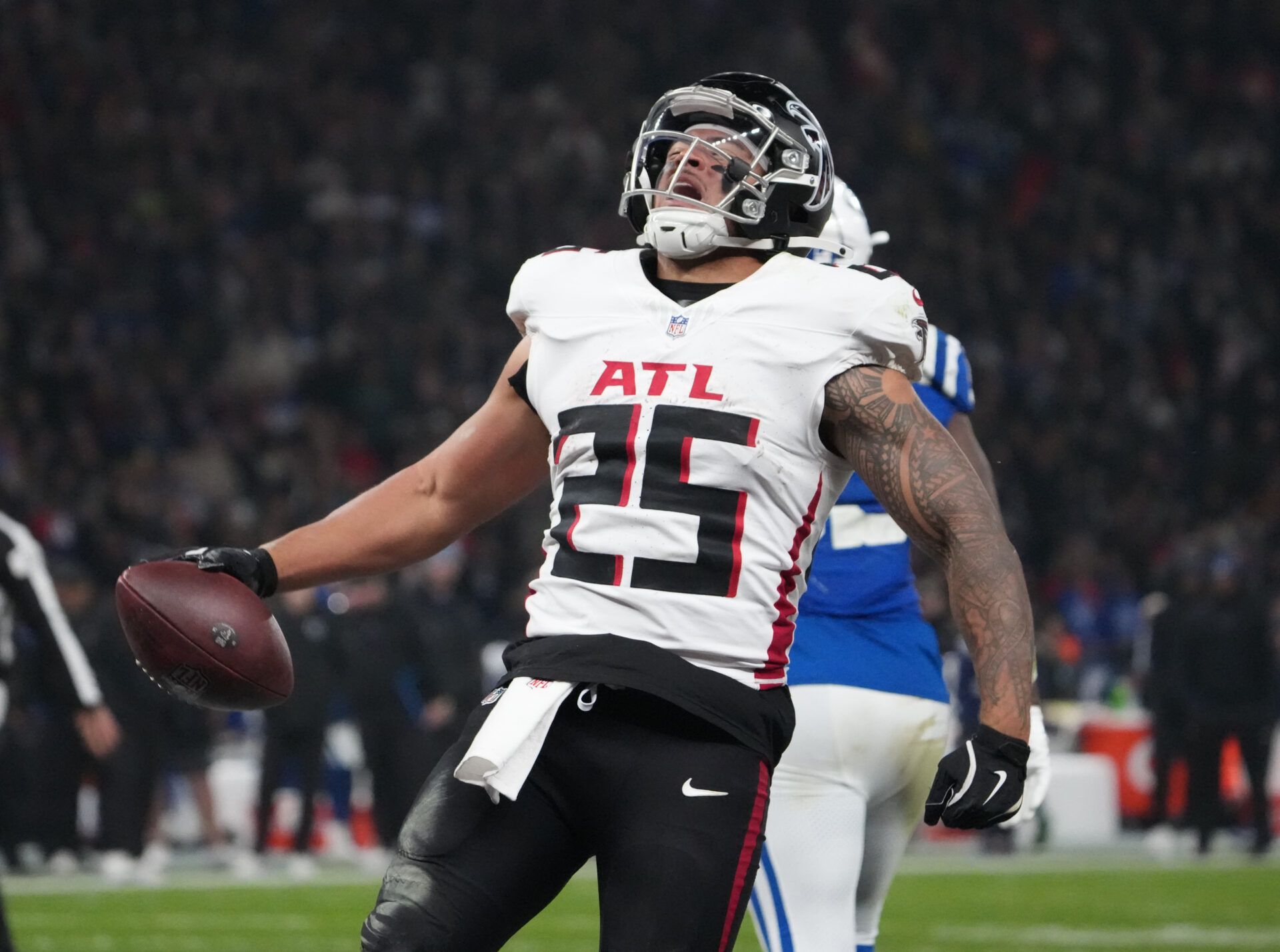 Atlanta Falcons running back Tyler Allgeier (25) celebrates after scoring a touchdown against the Indianapolis Colts during the NFL Berlin Game at Olympic Stadium.