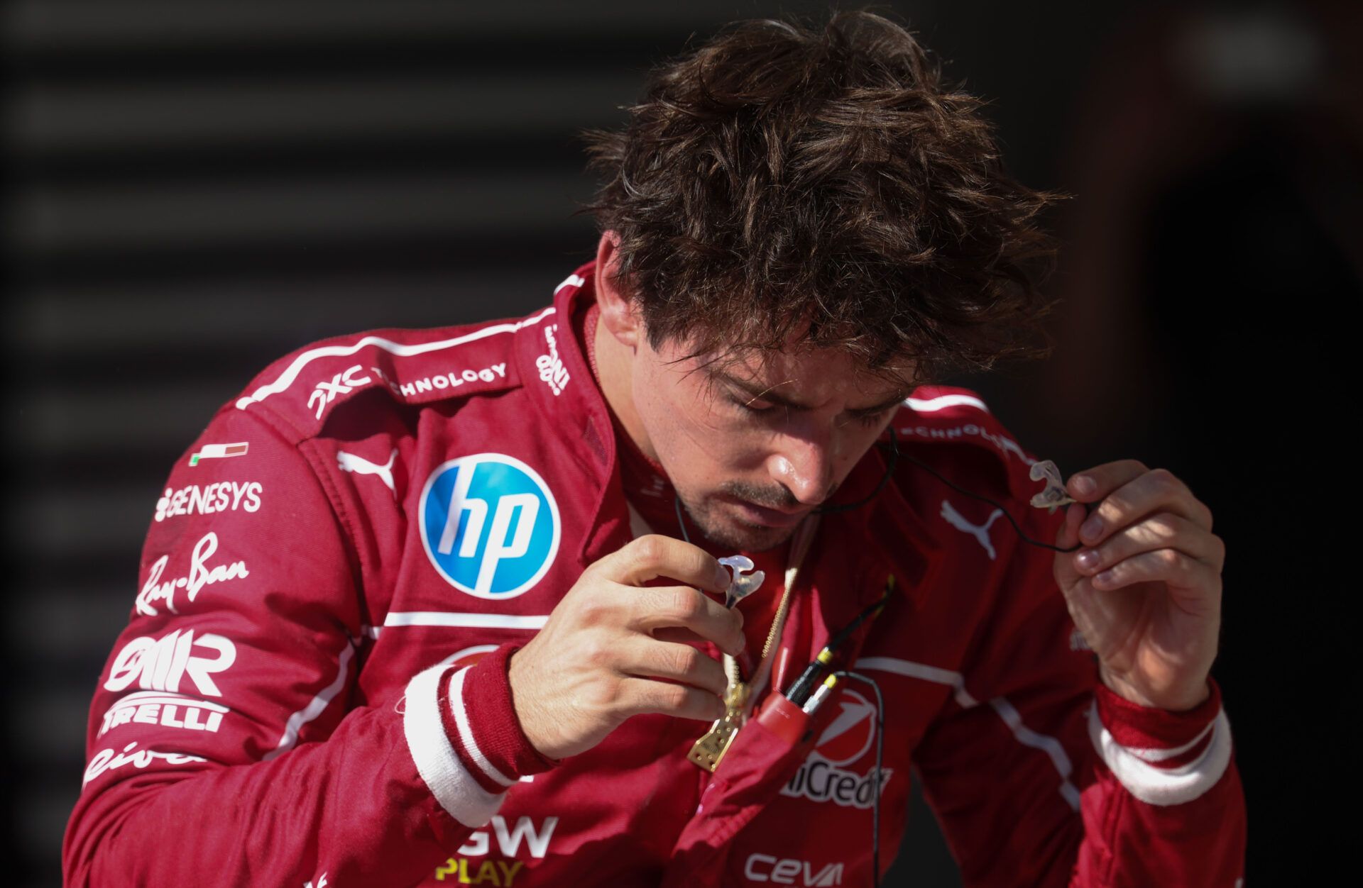 Scuderia Ferrari HP driver Charles Leclerc (16) of Team Monaco  removes his protective equipment after the race at Circuit of The Americas Austin.