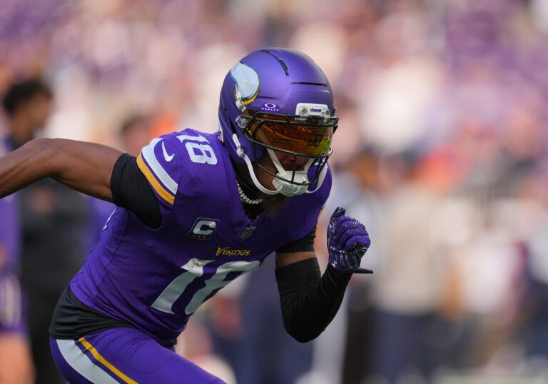 Minnesota Vikings wide receiver Justin Jefferson (18) warms up before a game against the Chicago Bears at U.S. Bank Stadium.