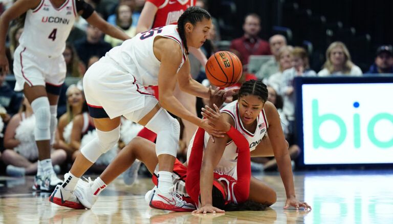 UConn Huskies guard Azzi Fudd (35) and forward Sarah Strong (21) defend against Ohio State Buckeyes guard Kennedy Cambridge (3) in the first half at Peoples Bank Arena.