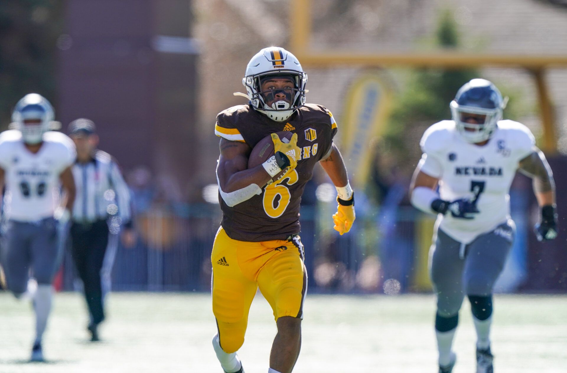 Wyoming Cowboys running back Xazavian Valladay (6) scores a touchdown during the first quarter against the Nevada Wolf Pack at Jonah Field War Memorial Stadium.