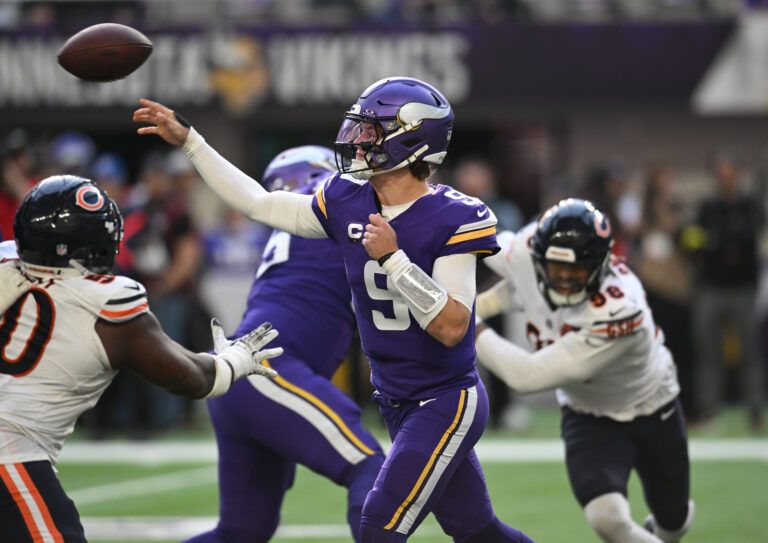 Minnesota Vikings quarterback J.J. McCarthy (9) throws downfield during the second quarter against the Chicago Bears at U.S. Bank Stadium.