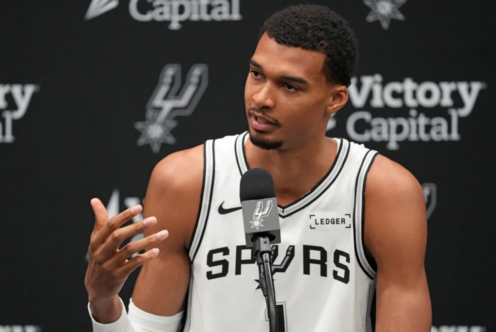 San Antonio Spurs forward-center Victor Wembanyama (1) answers questions from the media during Media Day at Victory Capital Performance Center in San Antonio.