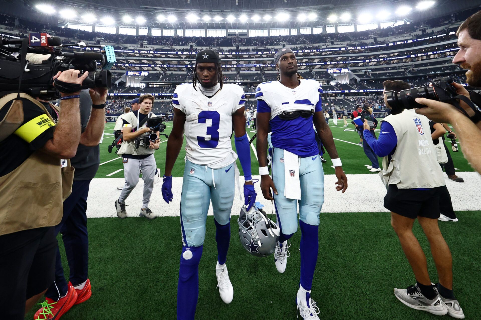 Dallas Cowboys wide receiver George Pickens (3) walks off the field in a walking cast after the game against the New York Giants at AT&T Stadium.