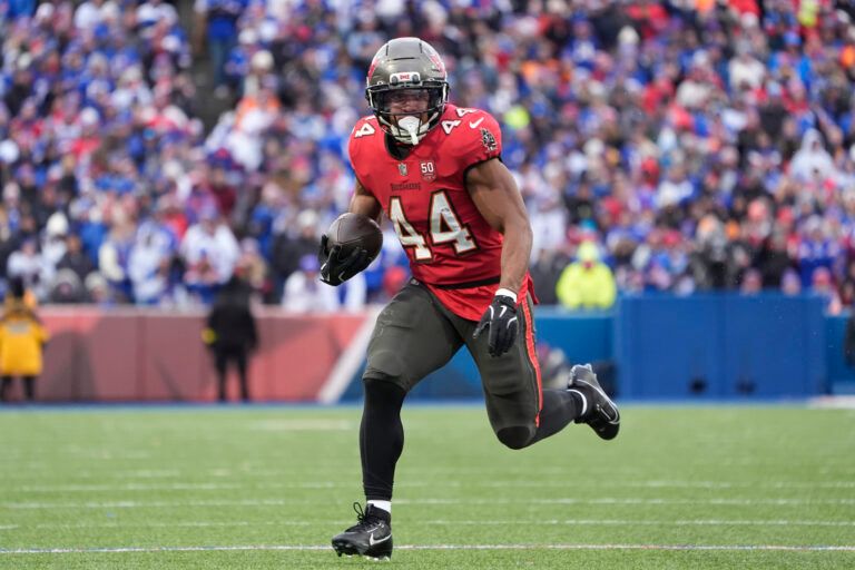 Tampa Bay Buccaneers running back Sean Tucker (44) runs the ball for a touchdown against the Buffalo Bills during the second half of the game at Highmark Stadium.