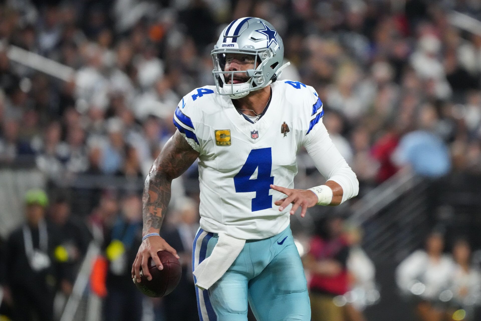 Dallas Cowboys quarterback Dak Prescott (4) looks to pass against the Las Vegas Raiders during the second half at Allegiant Stadium.