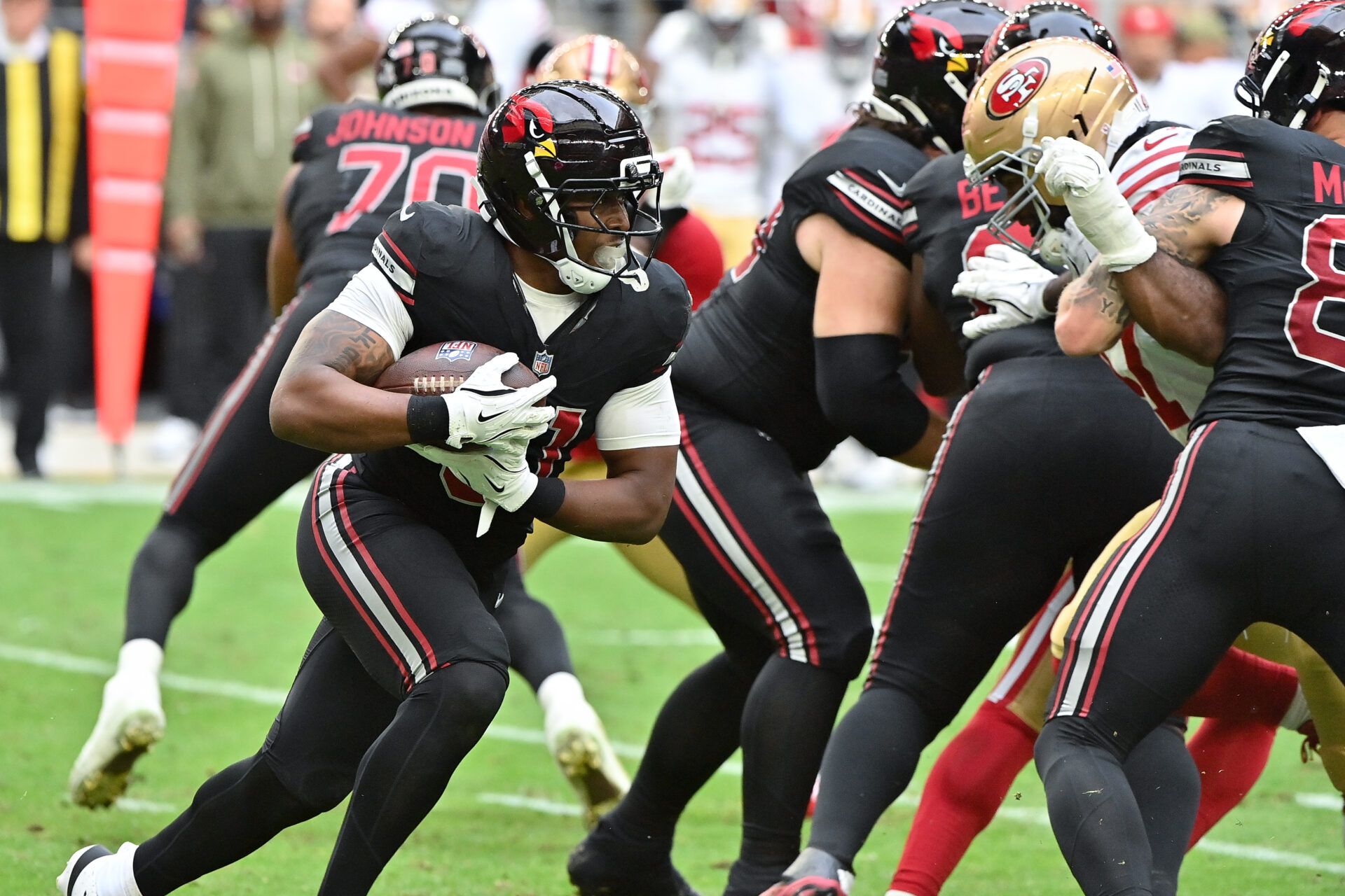 Arizona Cardinals running back Emari Demercado (31) runs the ball in the first half against the San Francisco 49ers at State Farm Stadium.