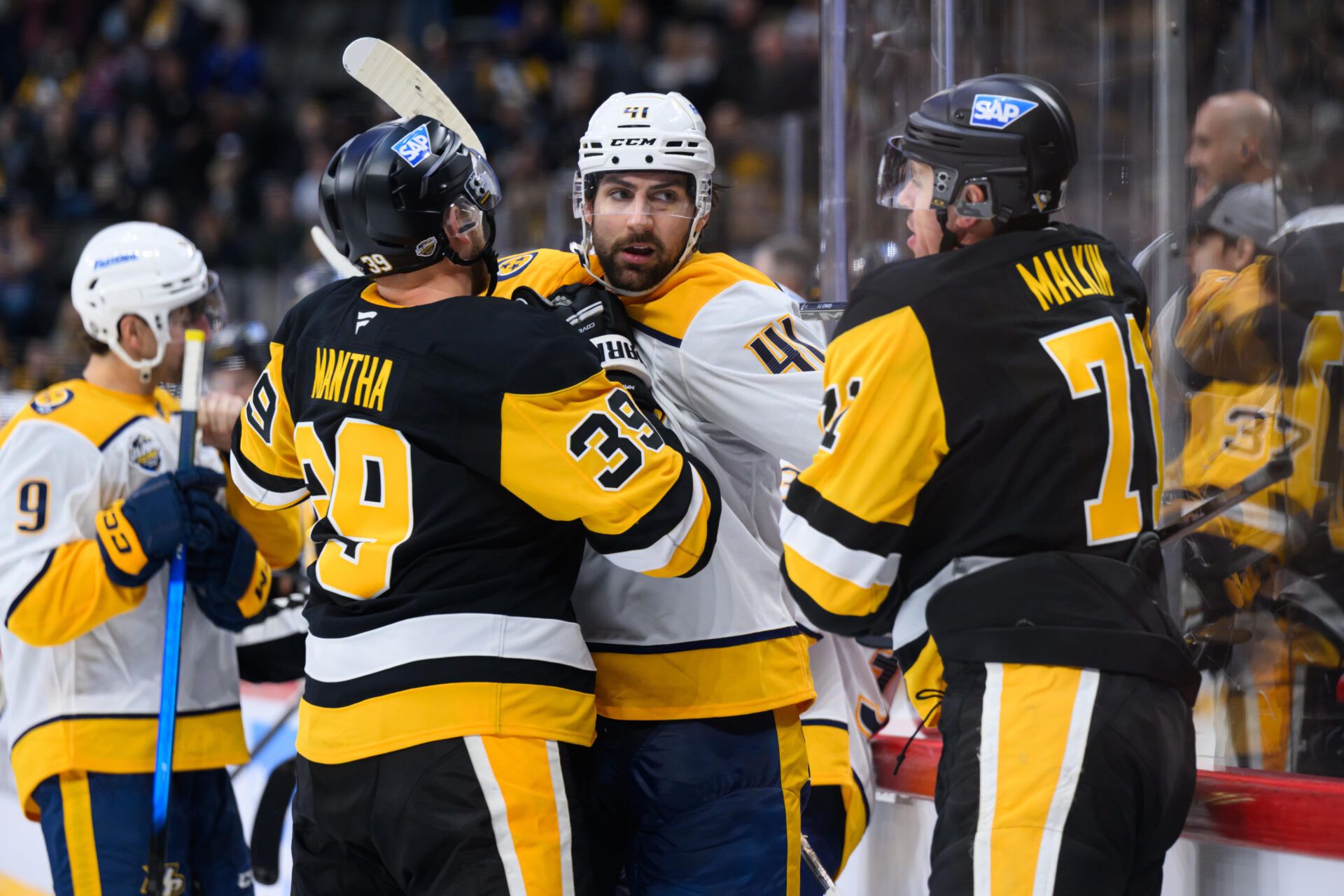 Nashville Predators defenseman Nicolas Hague (41) is restrained by Pittsburgh Penguins right wing Anthony Mantha (39) and Pittsburgh Penguins center Evgeni Malkin (71) in a Global Series ice hockey game at Avicii Arena.