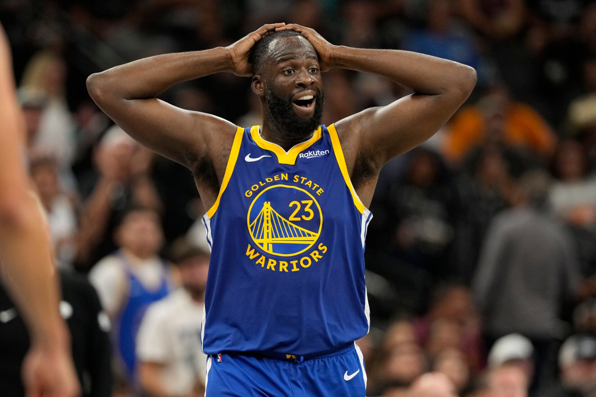 Golden State Warriors forward Draymond Green (23) reacts after being called for a foul during the second half against the San Antonio Spurs at Frost Bank Center.