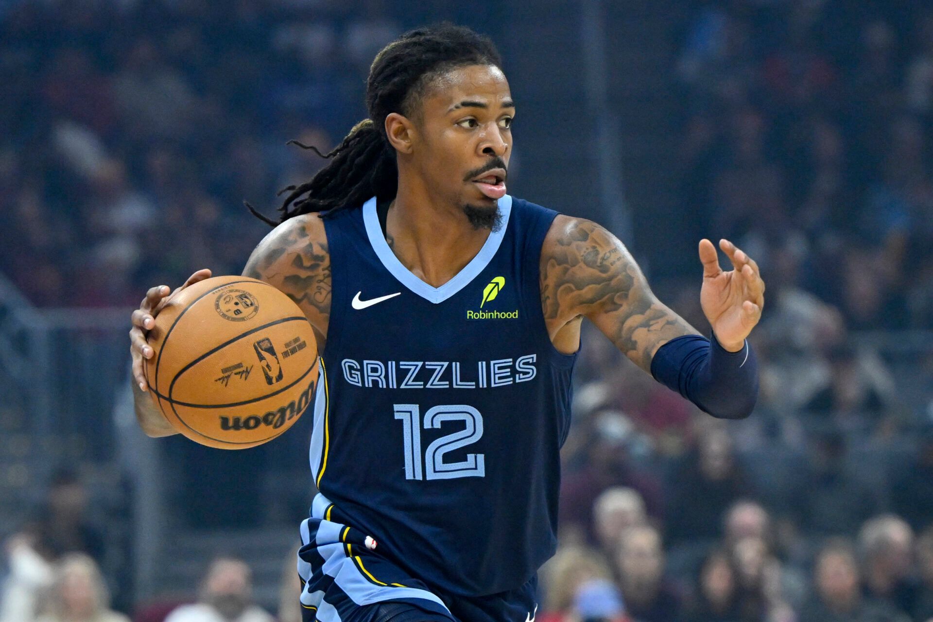 Memphis Grizzlies guard Ja Morant (12) dribbles the ball in the first quarter against the Cleveland Cavaliers at Rocket Arena.