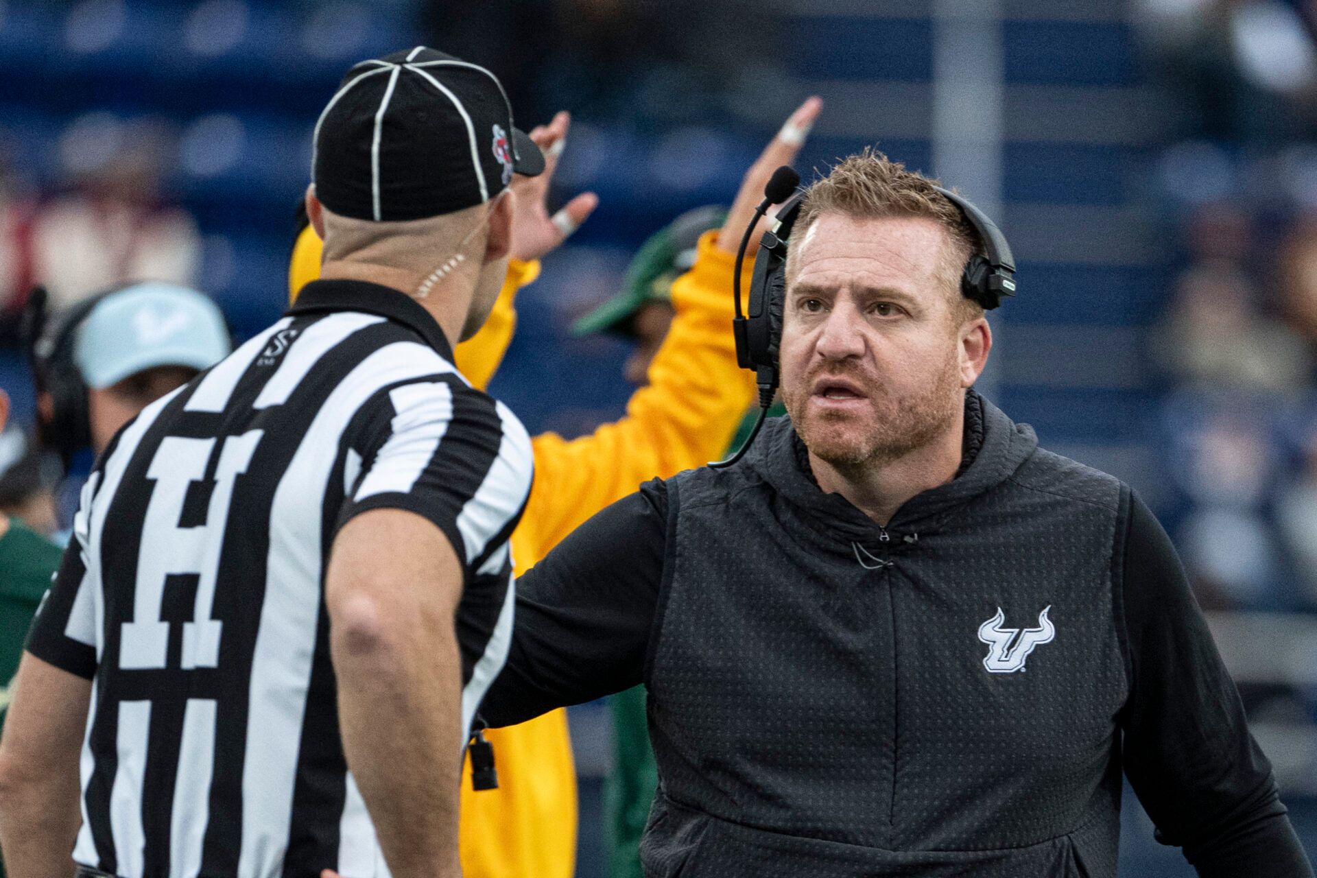 South Florida Bulls head coach Alex Golesh speaks with the head line judge during the second half against the Navy Midshipmen at Navy-Marine Corps Memorial Stadium. Navy Midshipmen defeated South Florida Bulls 41-28.