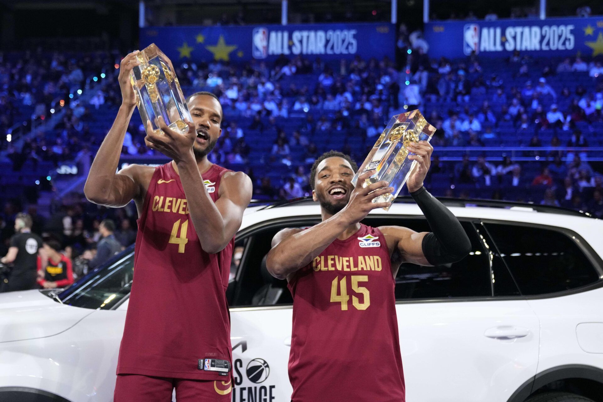Team Cavs center Evan Mobley (4) and guard Donovan Mitchell (45) of the Cleveland Cavaliers celebrate with the trophies after winning the skills challenge during All Star Saturday Night ahead of the 2025 NBA All Star Game at Chase Center.