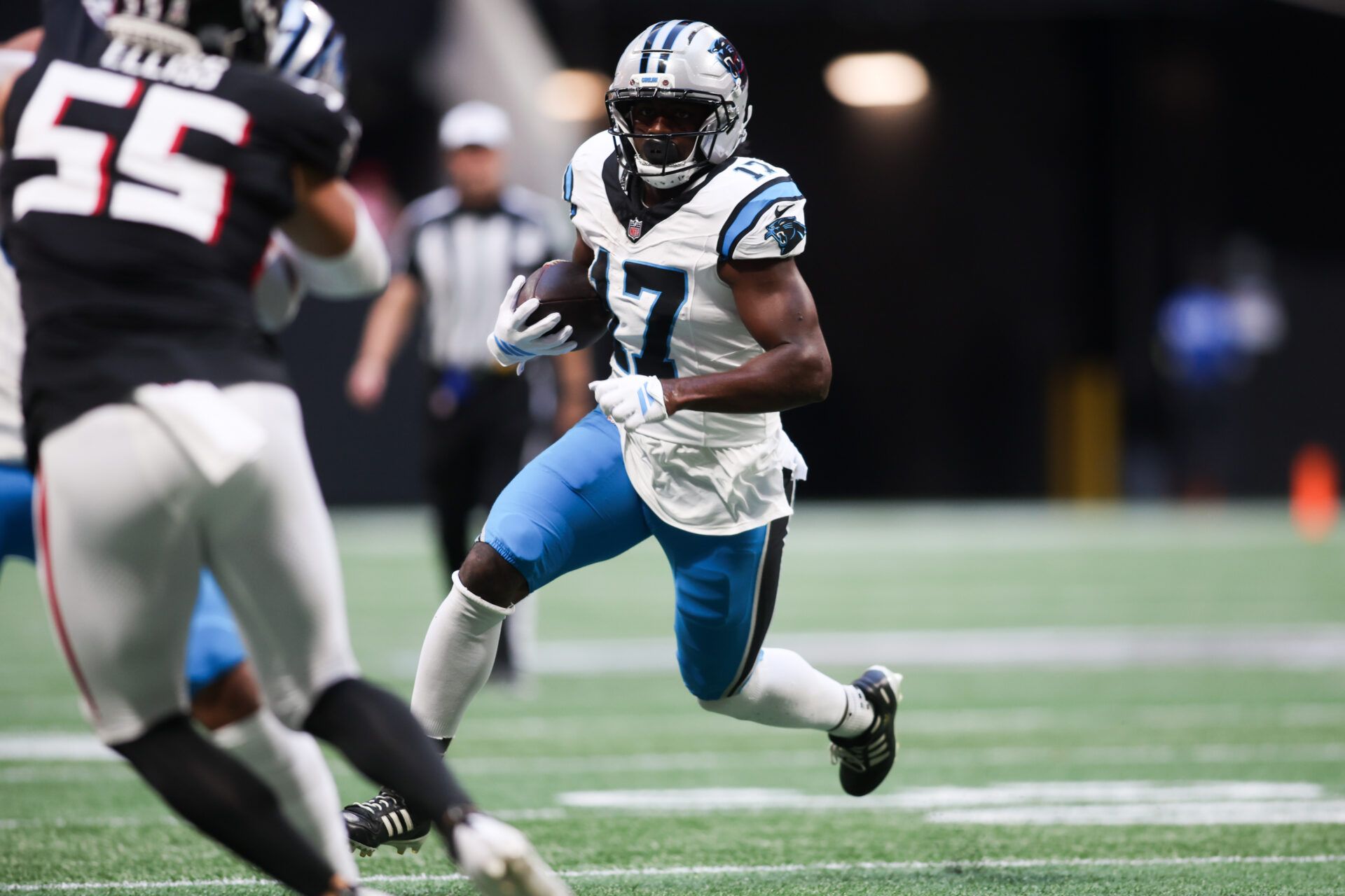Carolina Panthers wide receiver Xavier Legette (17) runs with the ball in the third quarter against the Atlanta Falcons at Mercedes-Benz Stadium.