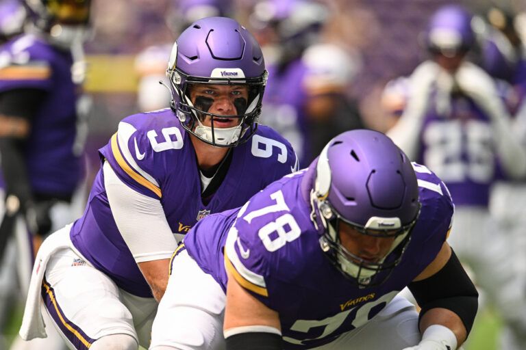 Minnesota Vikings quarterback J.J. McCarthy (9) and center Ryan Kelly (78) warm up before the game against the Houston Texans at U.S. Bank Stadium.