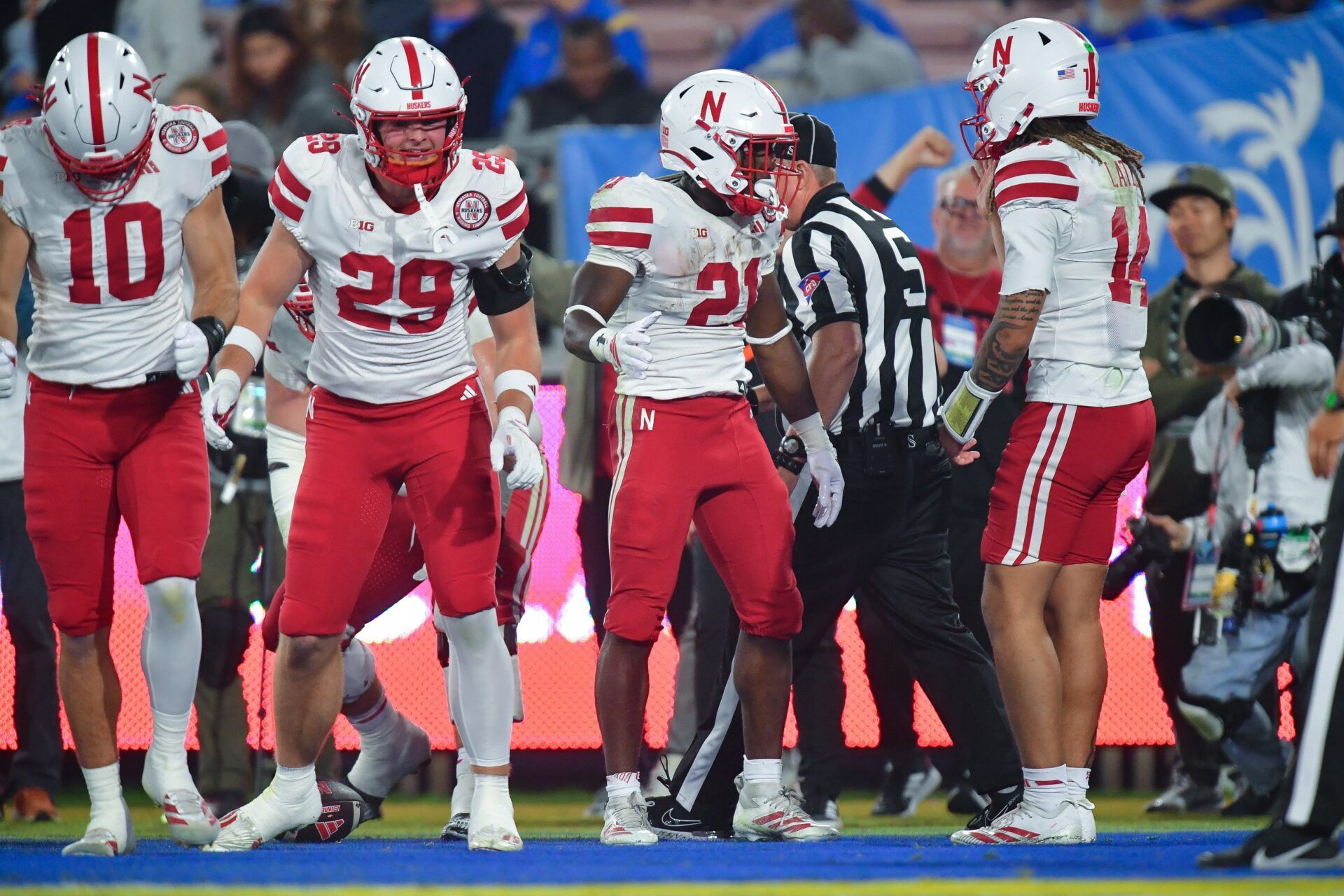 Nebraska Cornhuskers running back Emmett Johnson (21) celebrates his touchdown scored against the UCLA Bruins with quarterback TJ Lateef (14)  during the second half at the Rose Bowl.