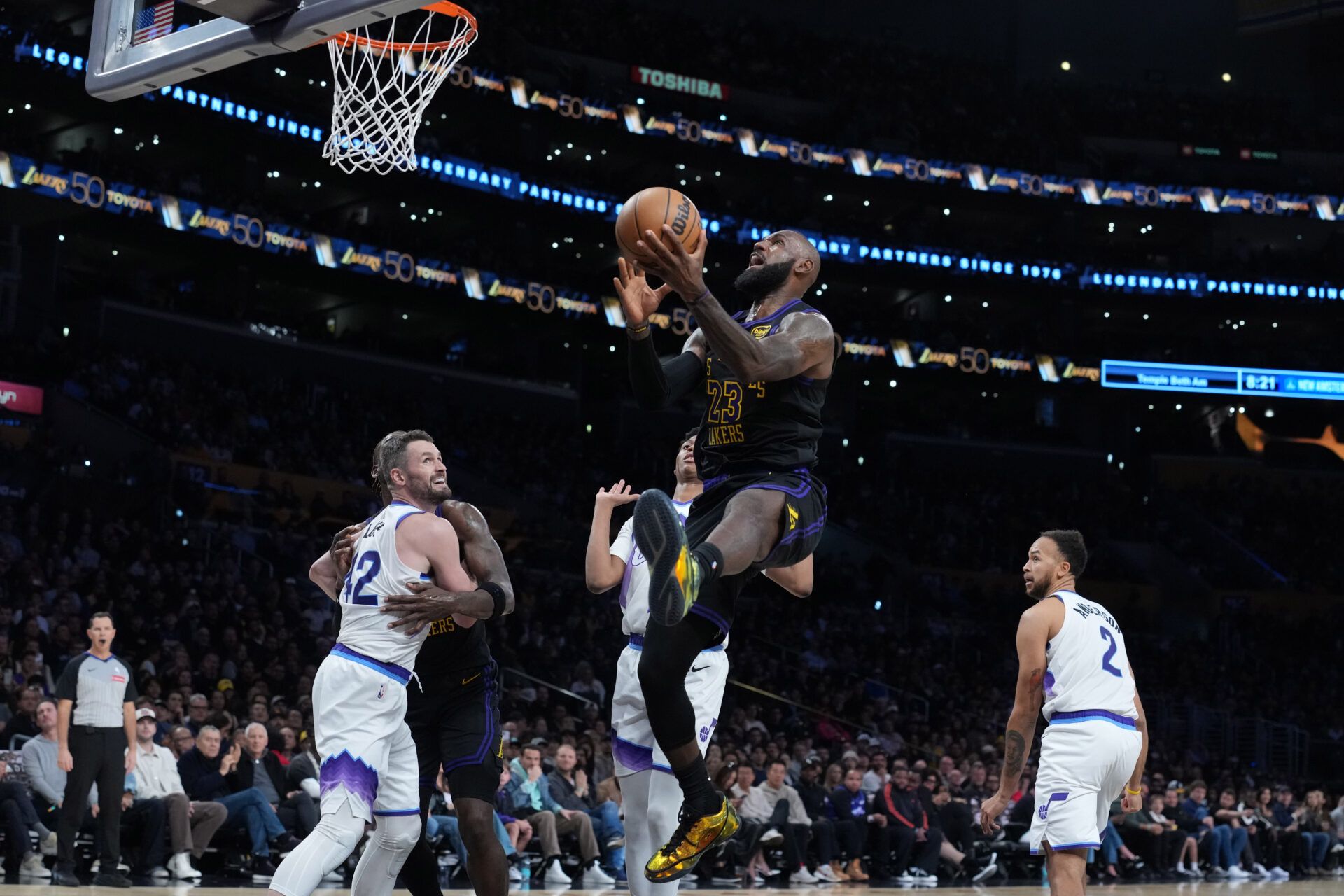Los Angeles Lakers forward LeBron James (23) shoots the ball against Utah Jazz forward Kevin Love (42), guard Ace Bailey (19) and forward Kyle Anderson (2)  in the second quarter at Crypto.com Arena.