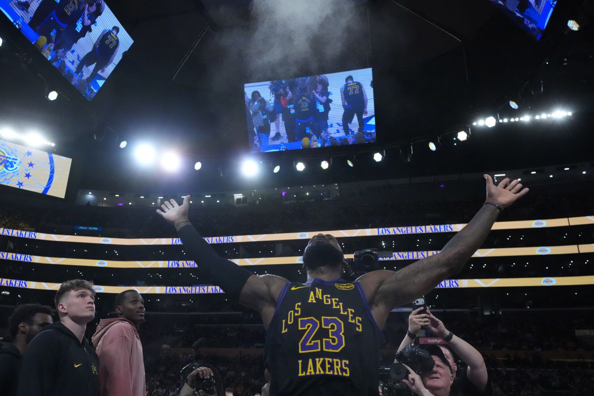 Los Angeles Lakers forward LeBron James (23) throws powdered chalk into the air during the game against the Utah Jazz at Crypto.com Arena.
