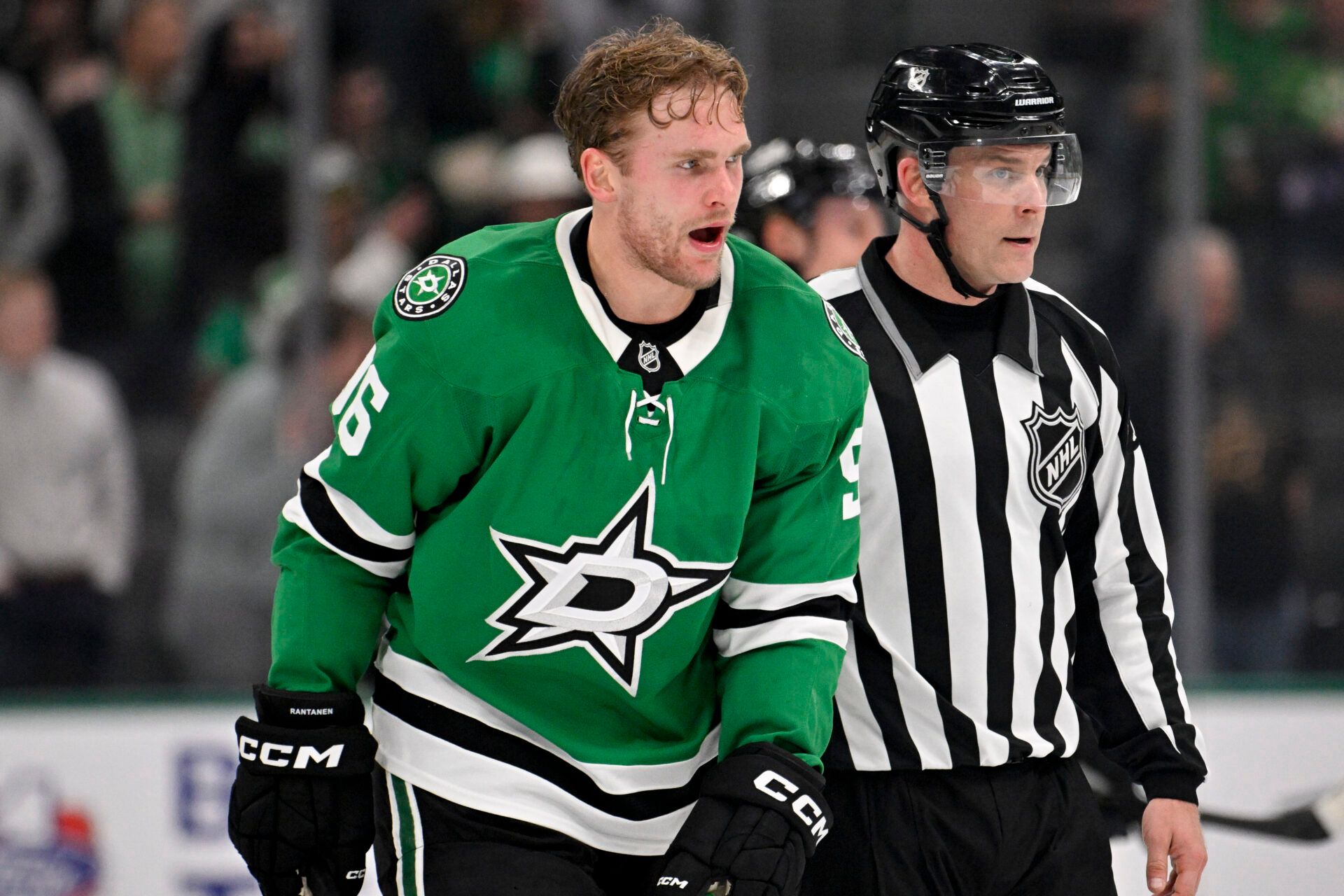 Dallas Stars right wing Mikko Rantanen (96) is led off the ice after he receives a game misconduct penalty for boarding on New York Islanders defenseman Alexander Romanov (not pictured) during the third period at the American Airlines Center.