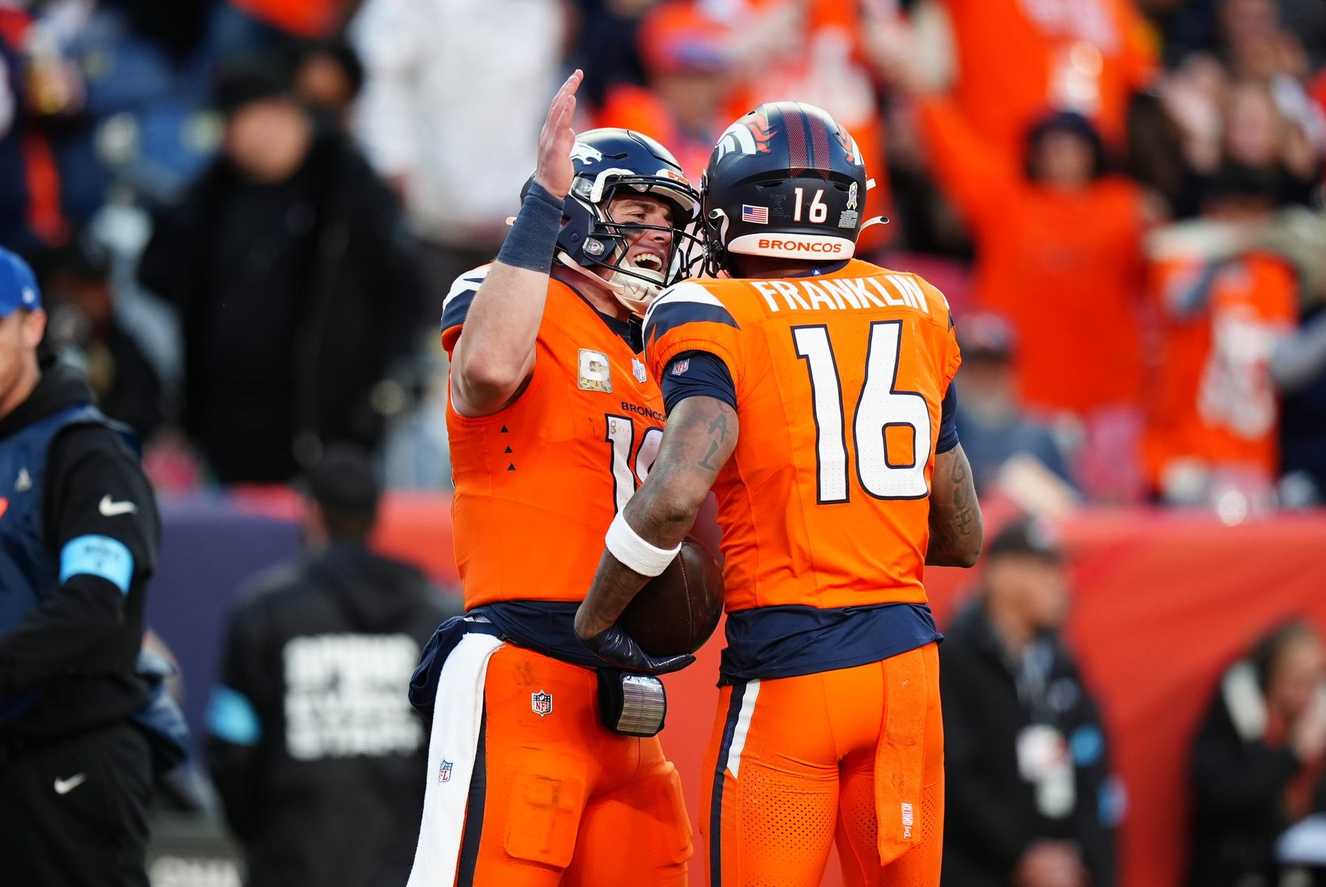 Denver Broncos wide receiver Troy Franklin (16) celebrates his touchdown with quarterback Bo Nix (10) in the second half against the Atlanta Falcons at Empower Field at Mile High.