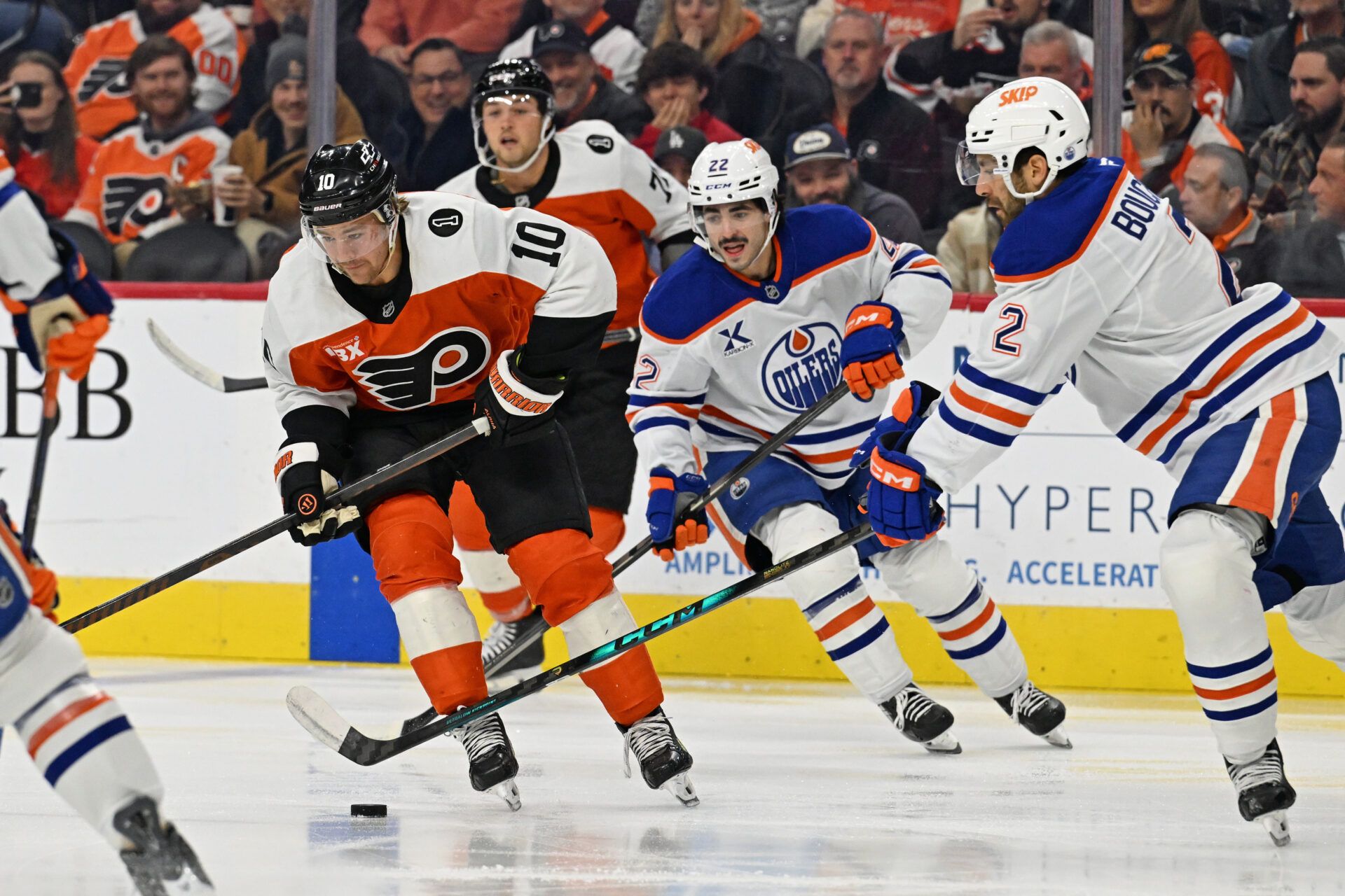 Philadelphia Flyers right wing Bobby Brink (10) is defended by Edmonton Oilers defenseman Evan Bouchard (2) during the first period at Xfinity Mobile Arena.