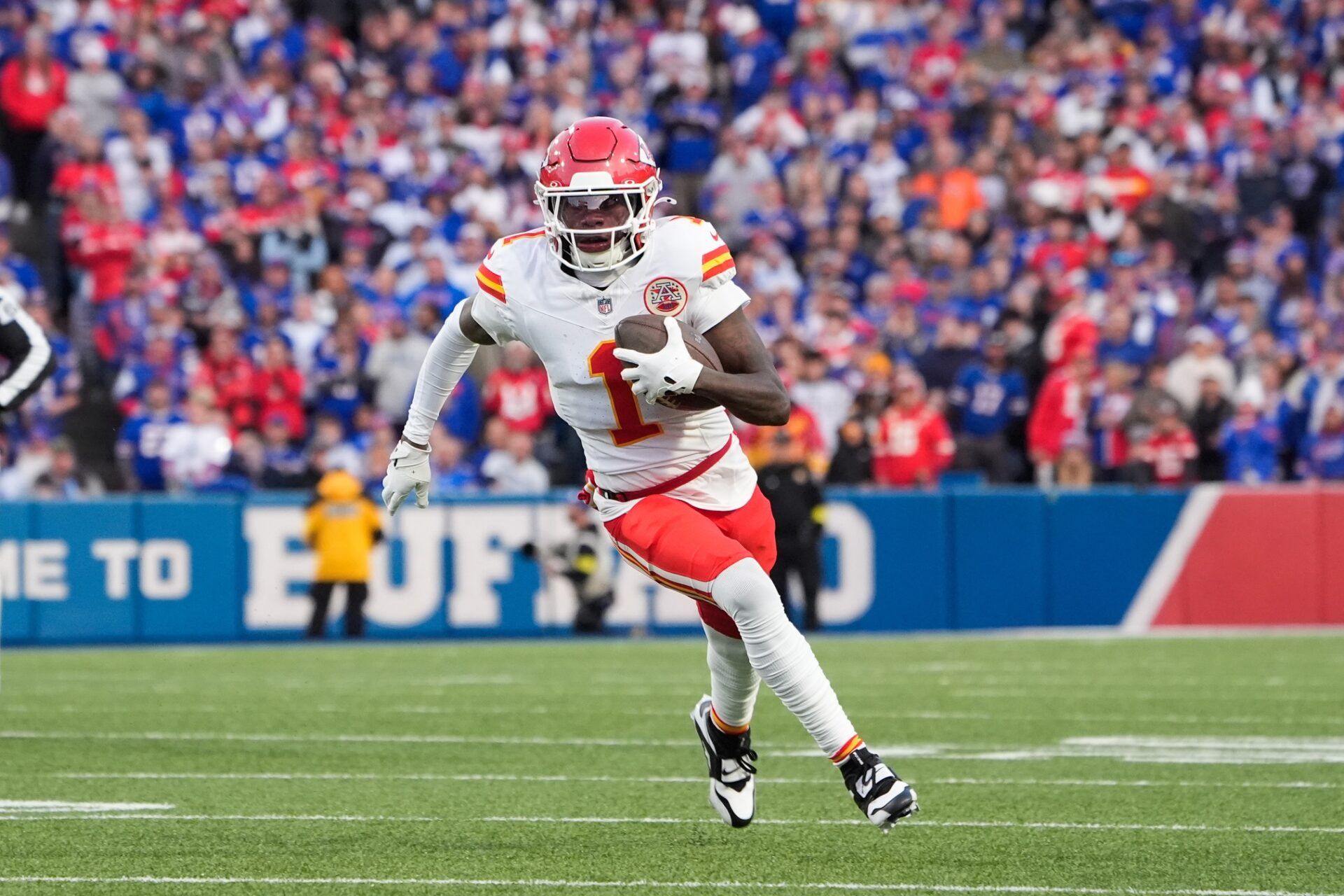 Kansas City Chiefs wide receiver Xavier Worthy (1) runs the ball after a catch in the first quarter against the Buffalo Bills at Highmark Stadium.